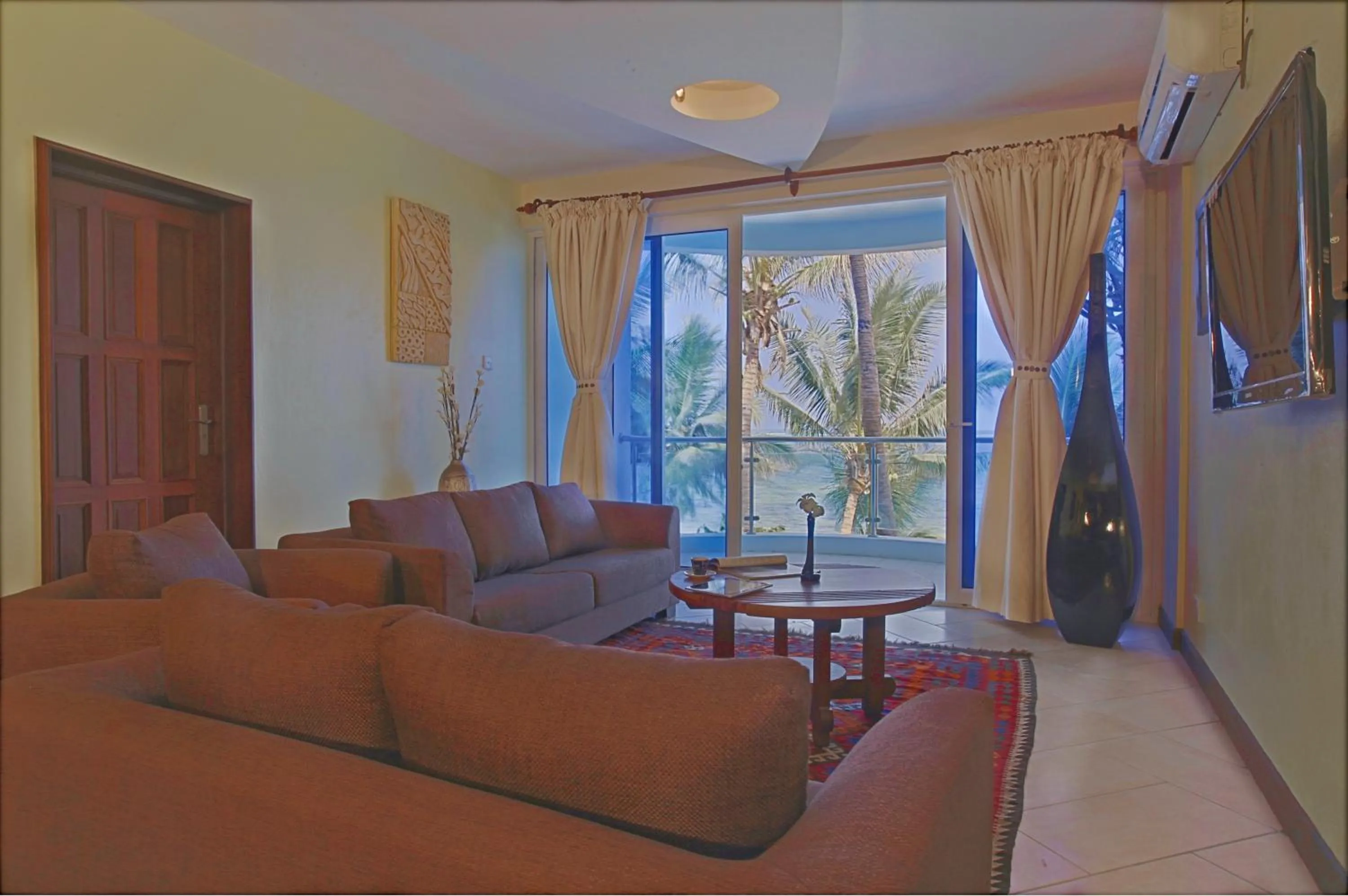 Living room in Cowrie Shell Beach Apartments Official