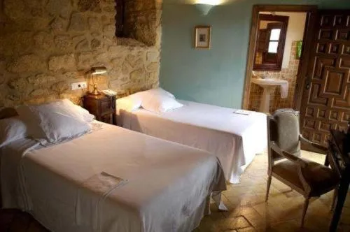 Photo of the whole room, Bed in Hospedería del Monasterio