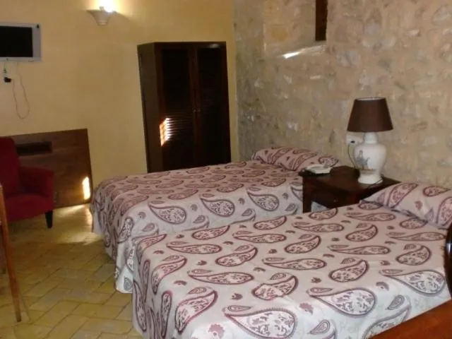 Photo of the whole room, Bed in Hospedería del Monasterio