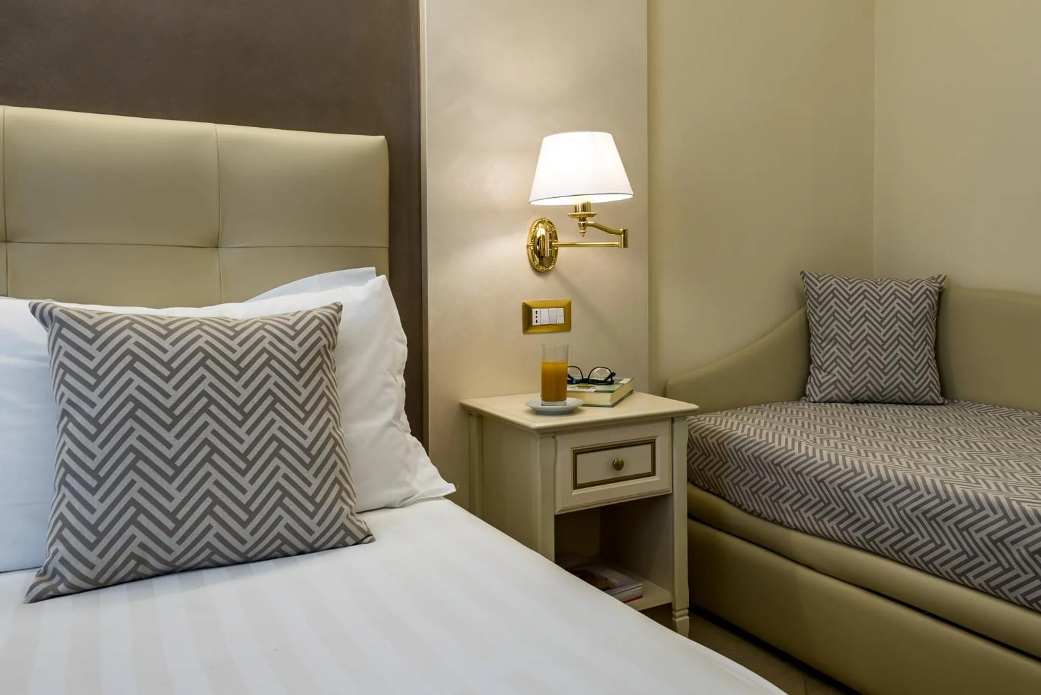 Bed in Vittorio Emanuele Boutique Hotel