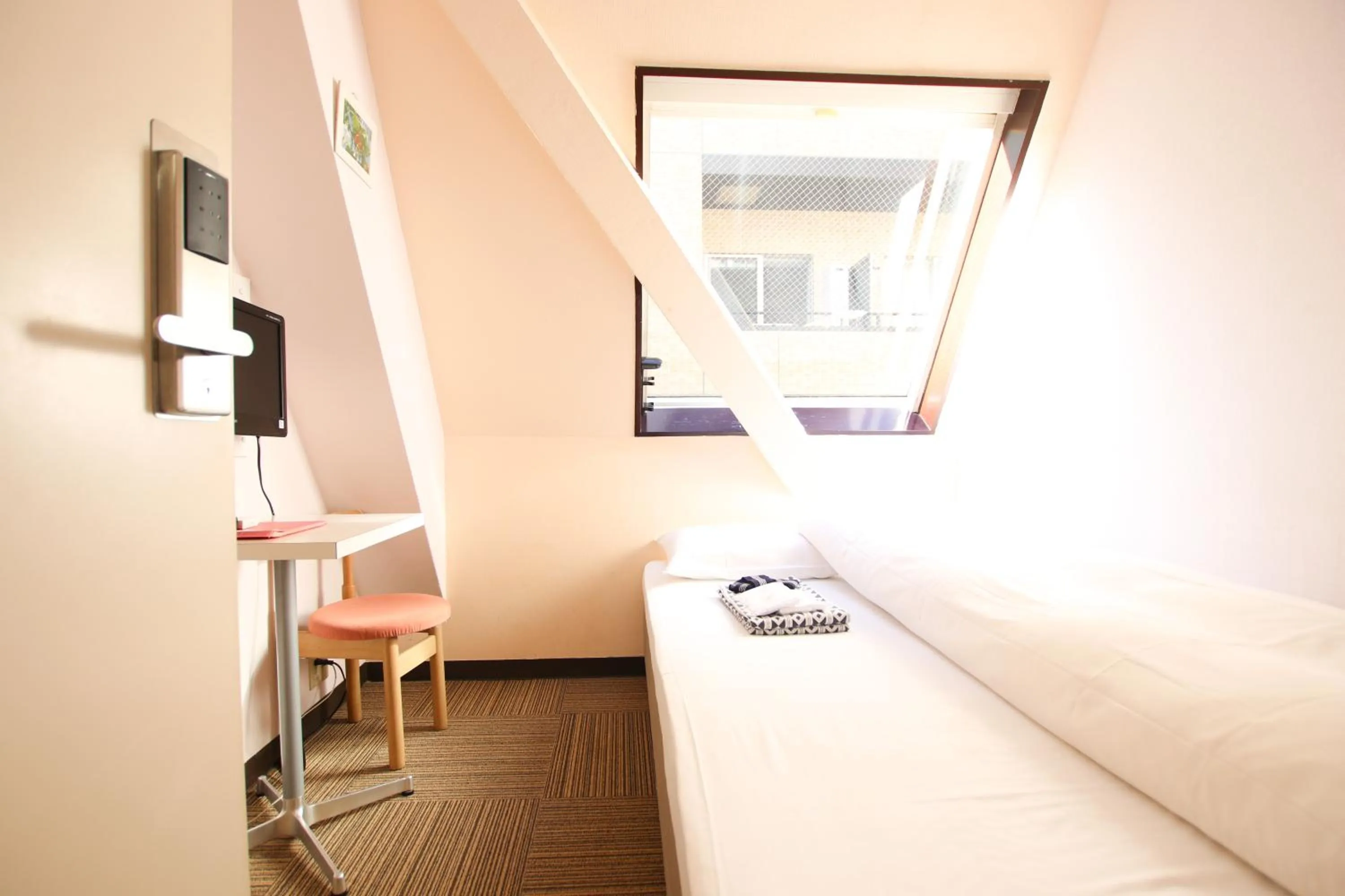 Bed in Sakura Hotel Jimbocho