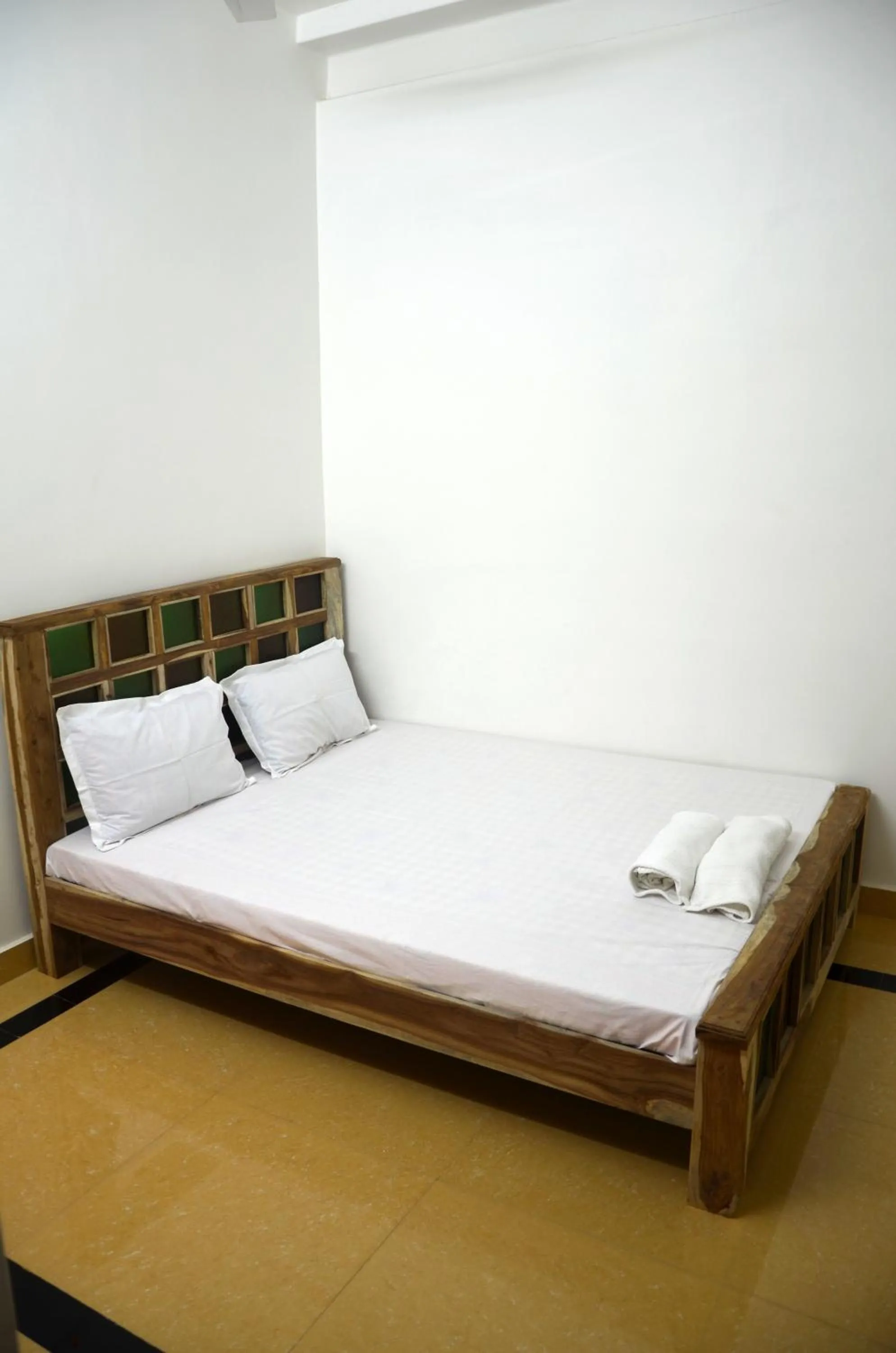 Bed in Gajanand Guest House