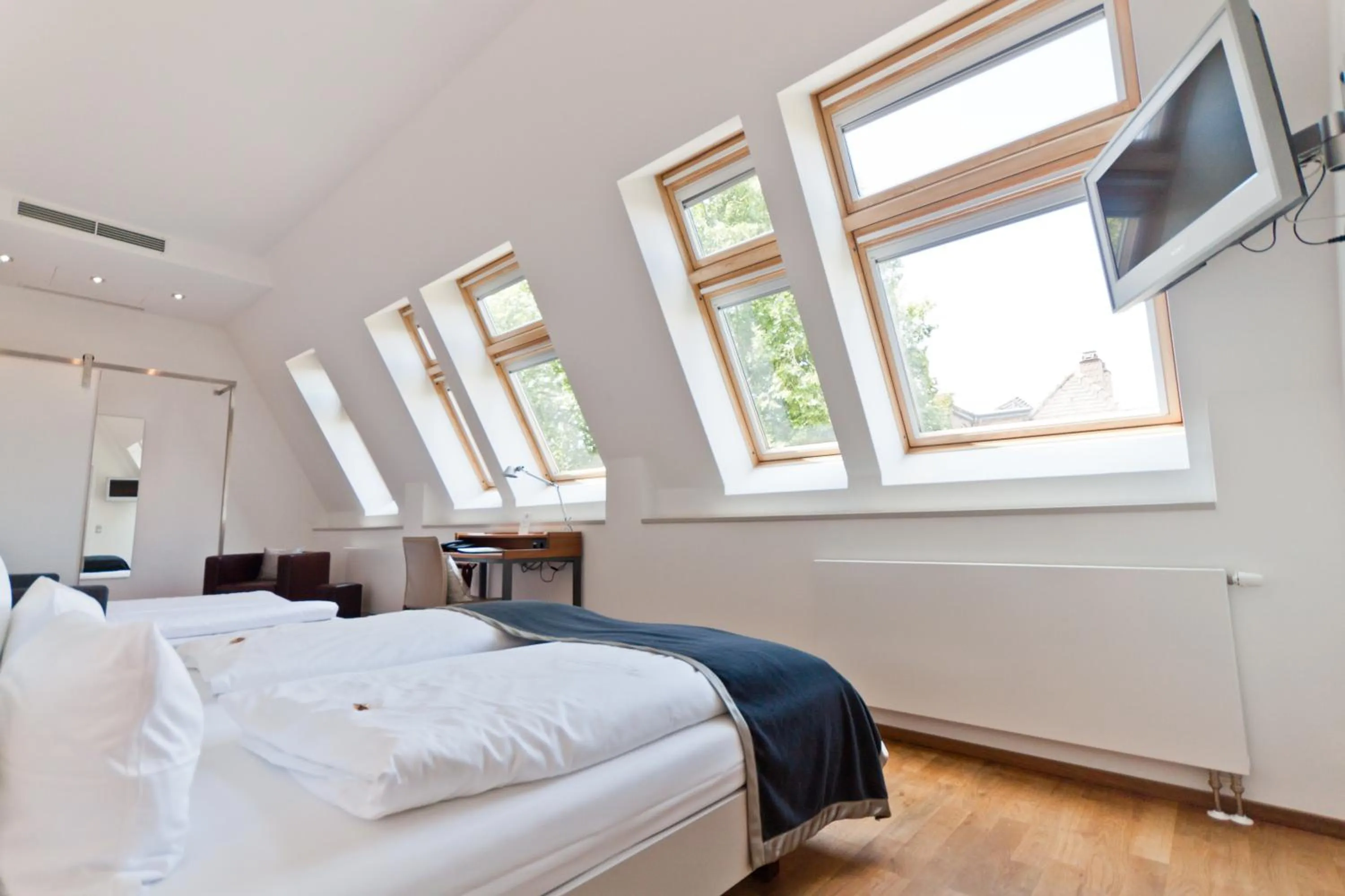 Photo of the whole room, Bed in Qube Hotel Bergheim