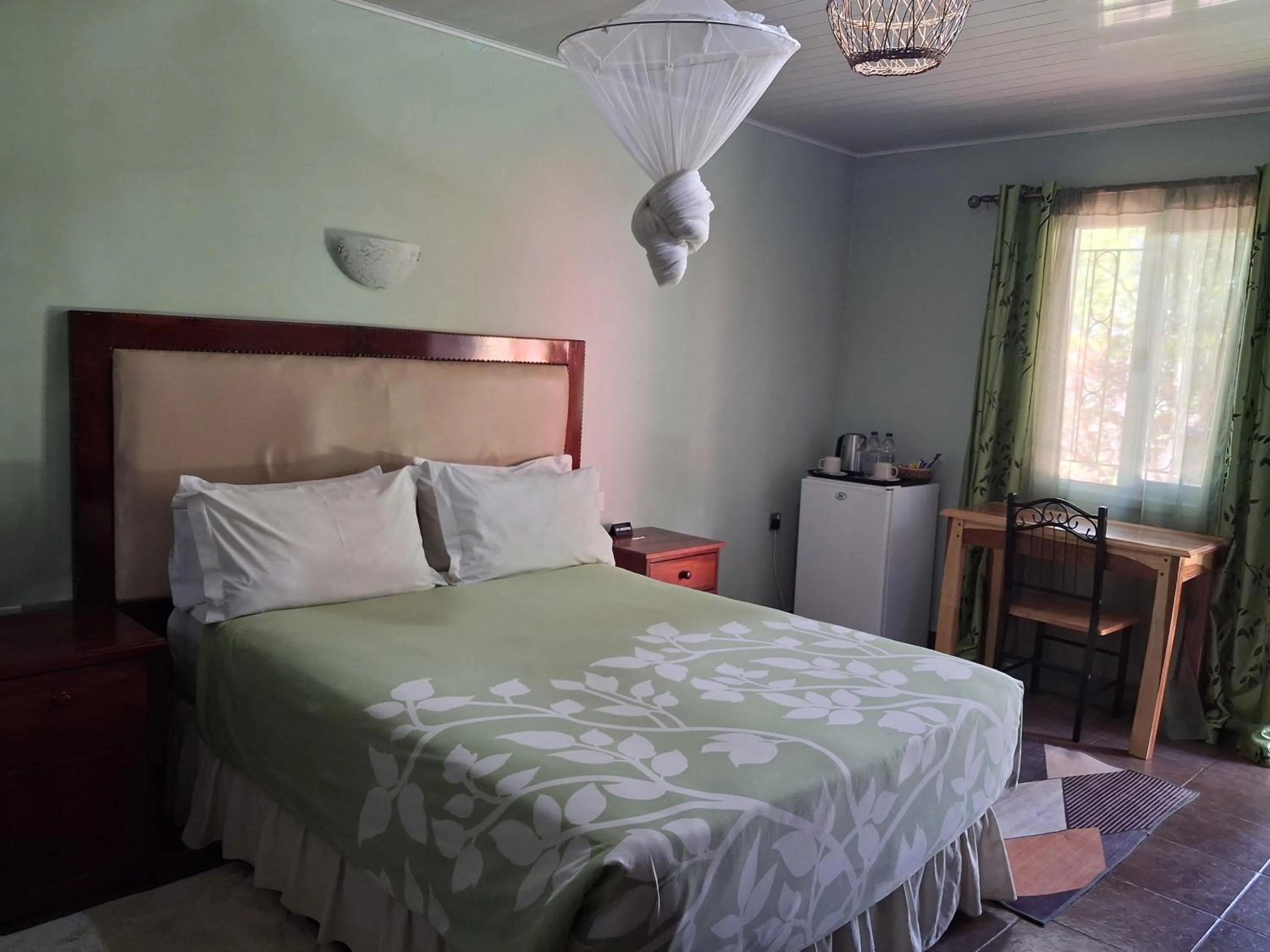 Bed in Gloria's Bed and Breakfast