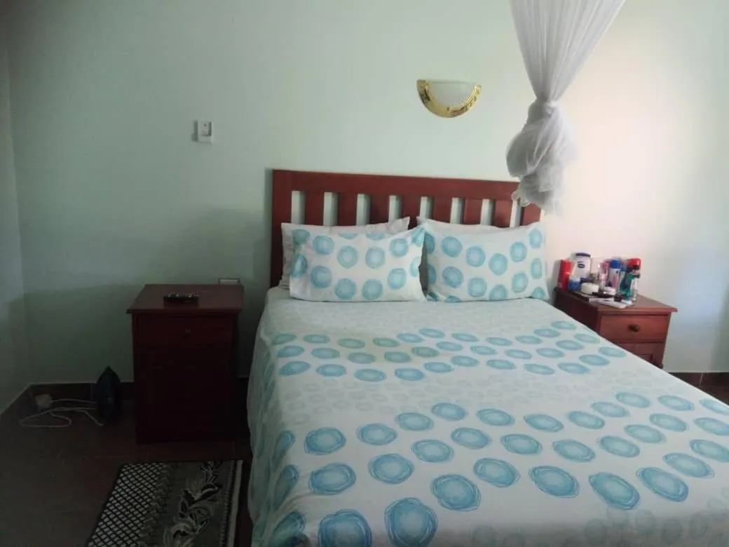 Bed in Gloria's Bed and Breakfast