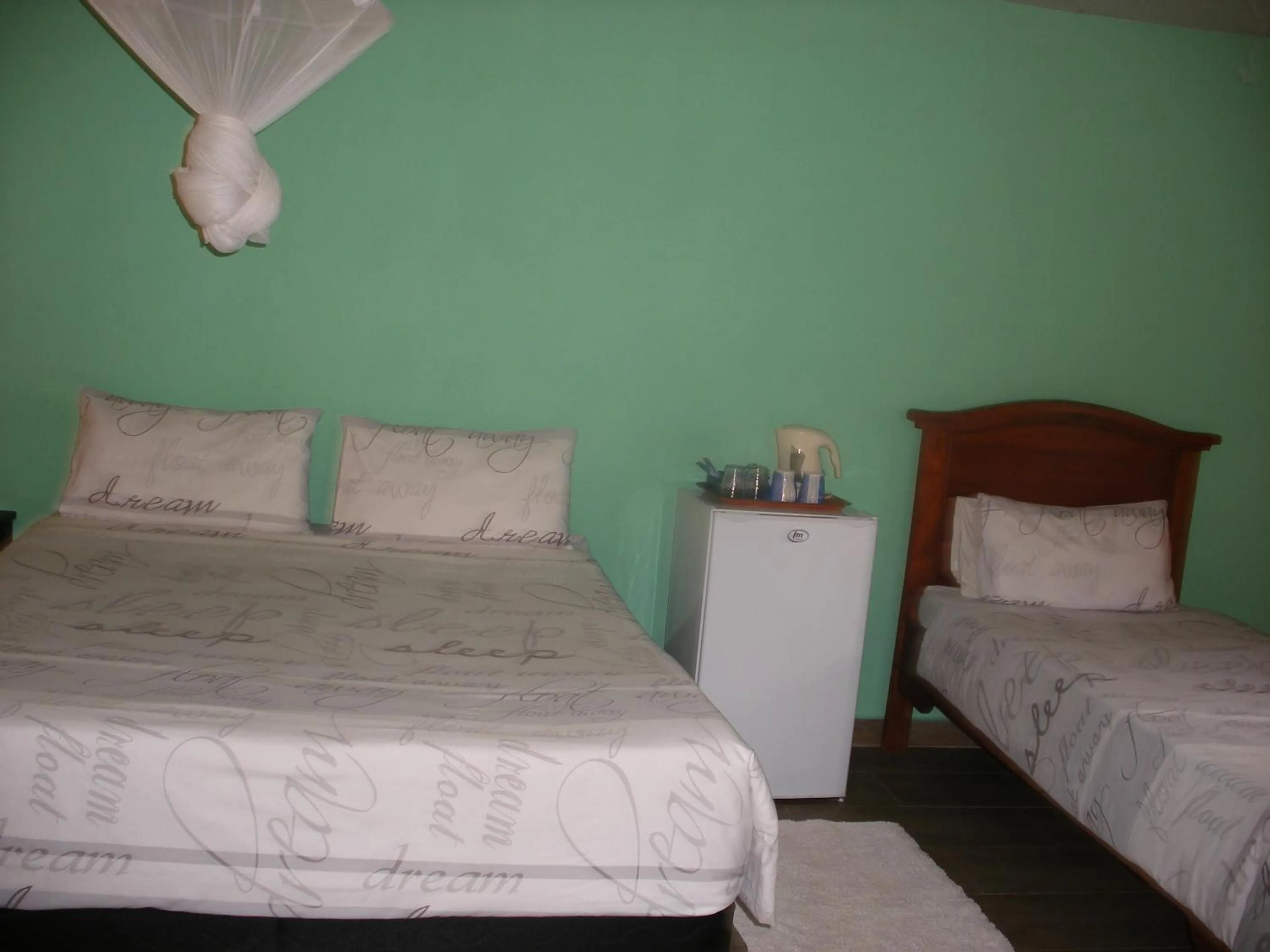 Bed in Gloria's Bed and Breakfast