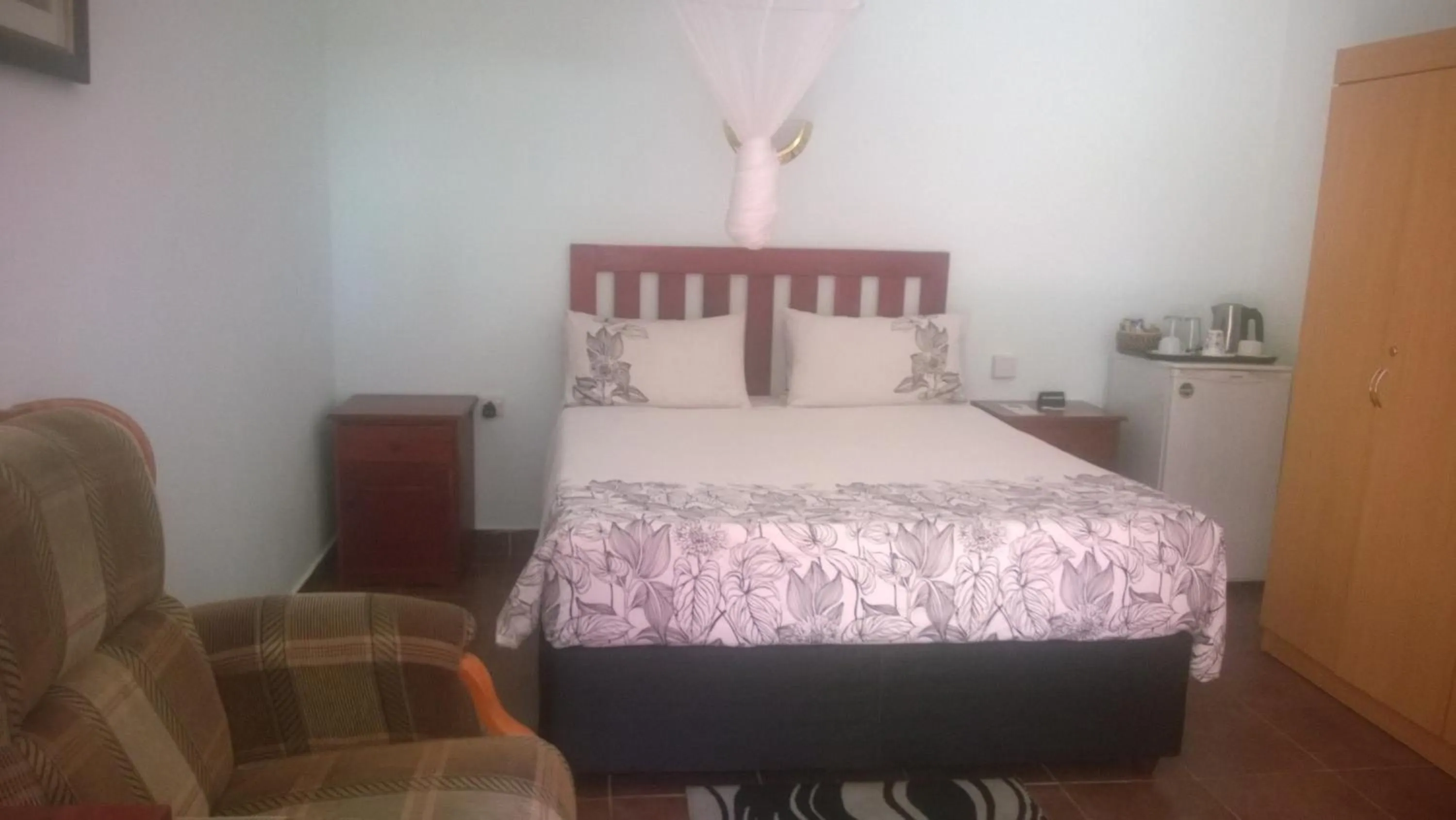 Bed in Gloria's Bed and Breakfast