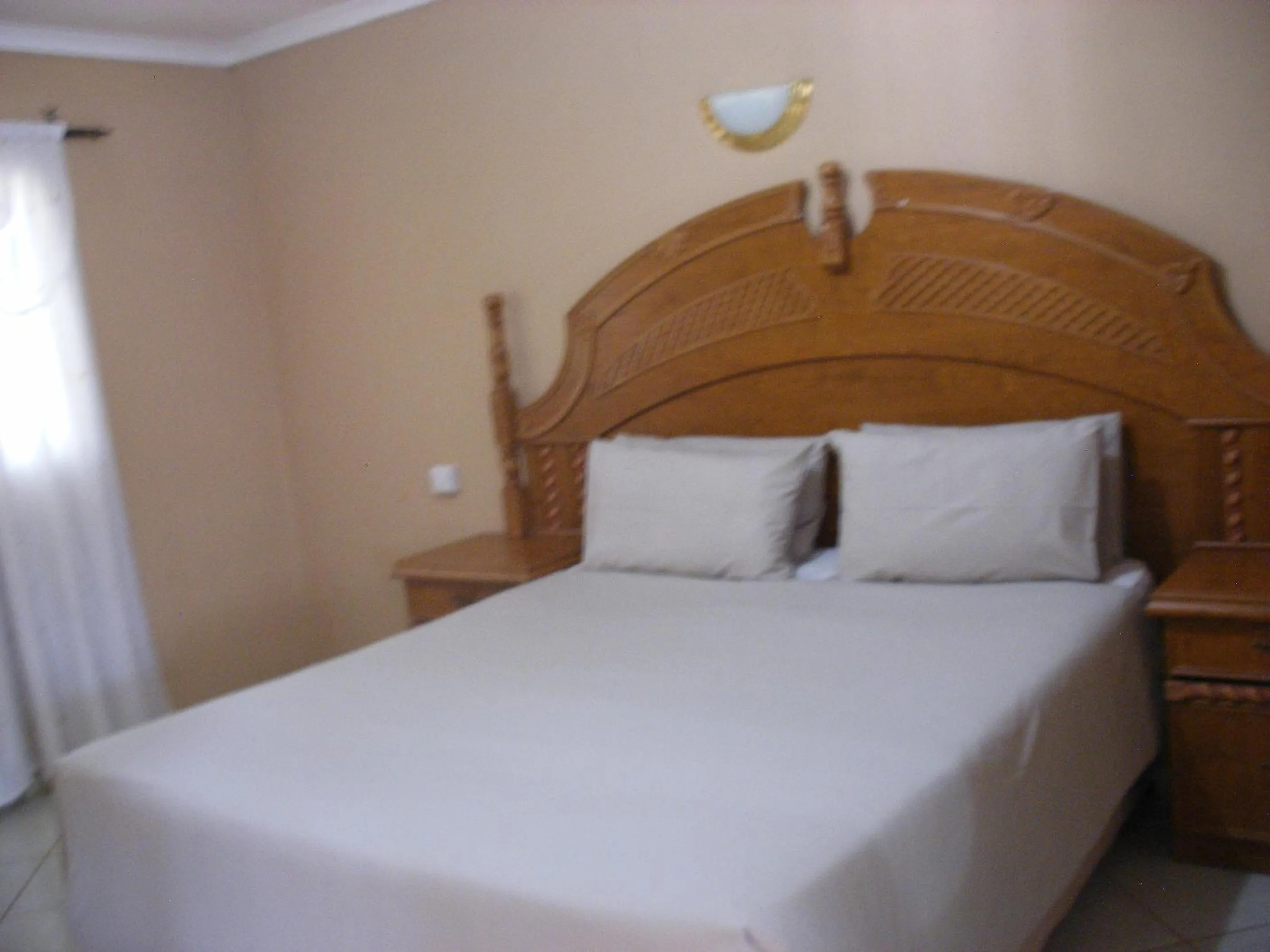 Bed in Gloria's Bed and Breakfast