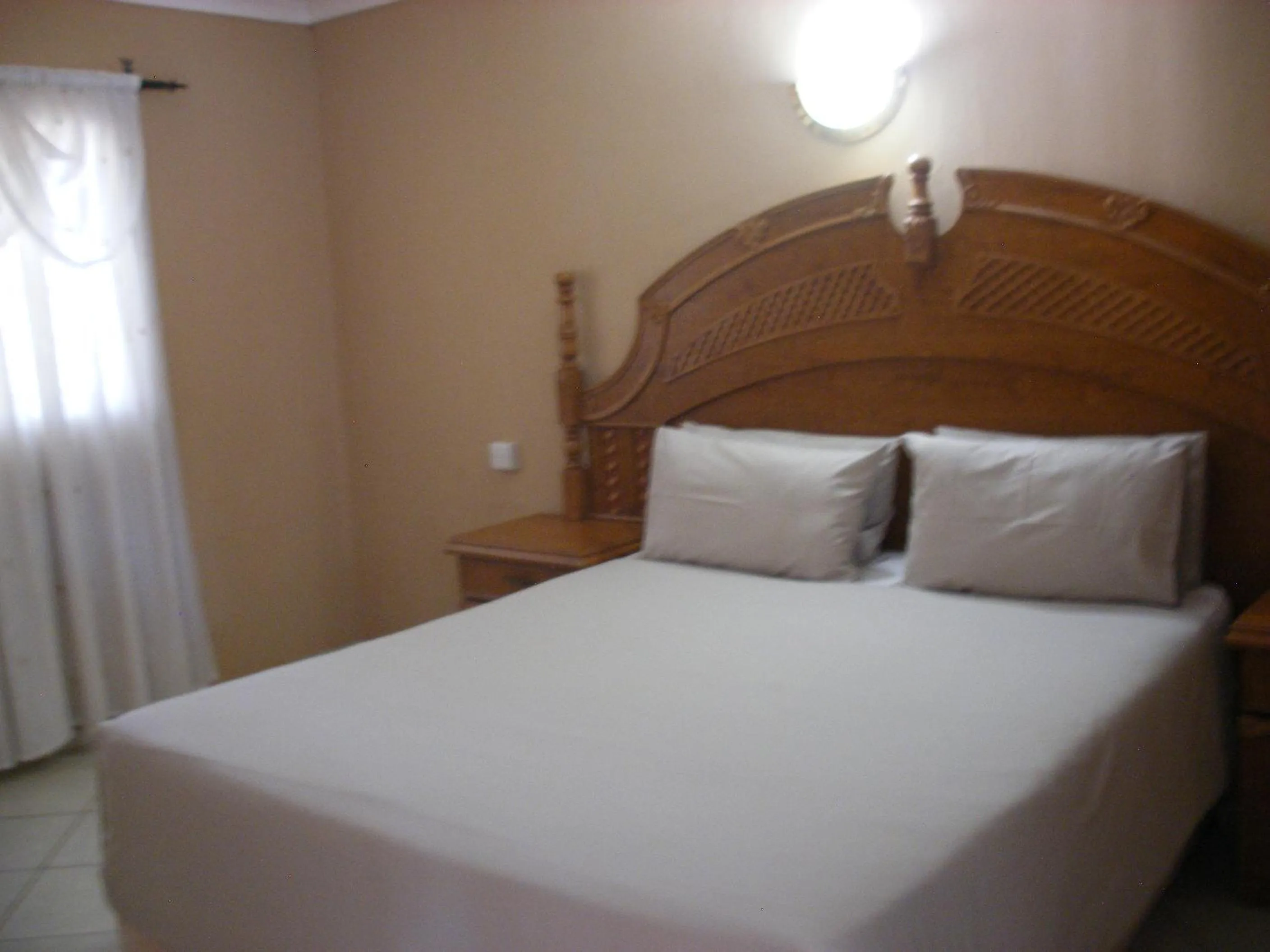 Bed in Gloria's Bed and Breakfast