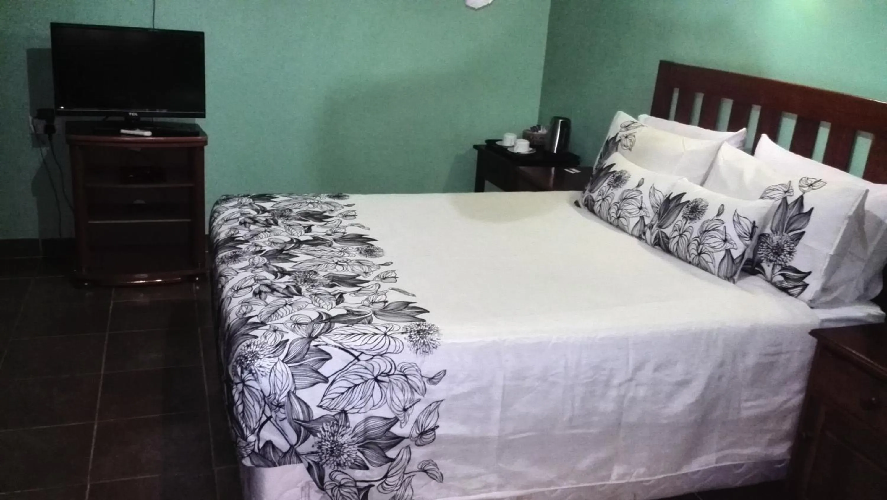 Bed in Gloria's Bed and Breakfast