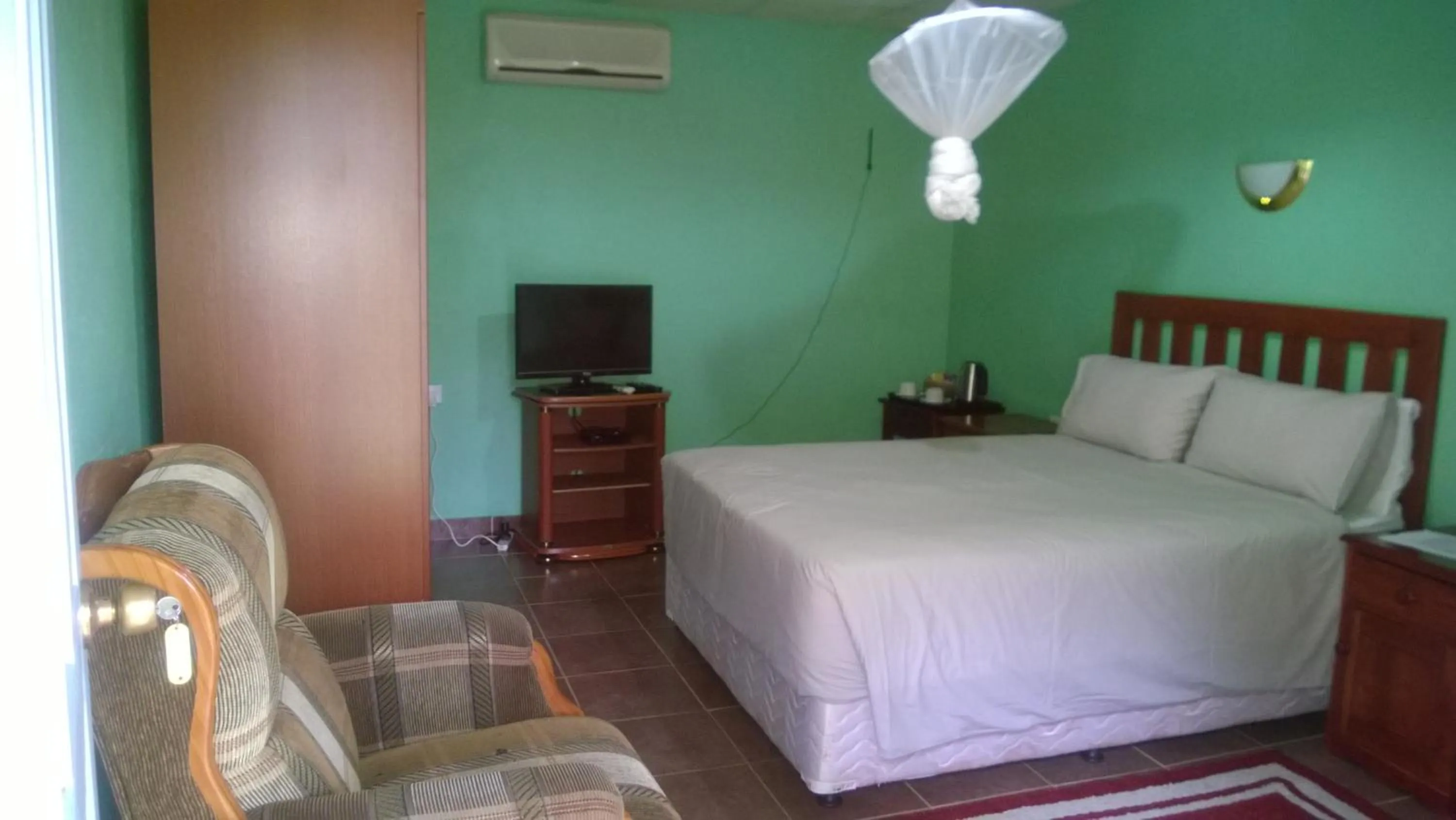 Bed in Gloria's Bed and Breakfast