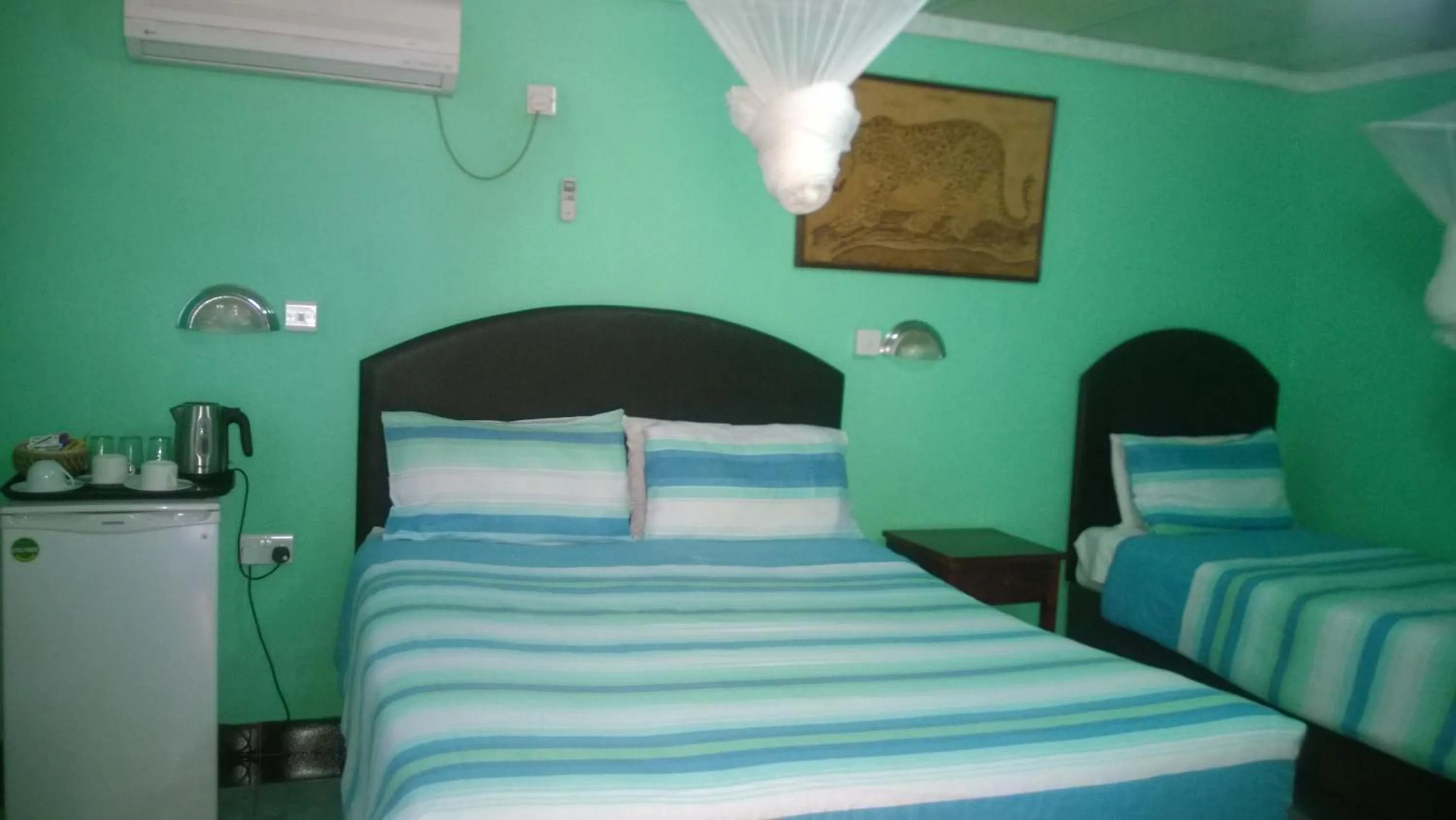 Bed in Gloria's Bed and Breakfast