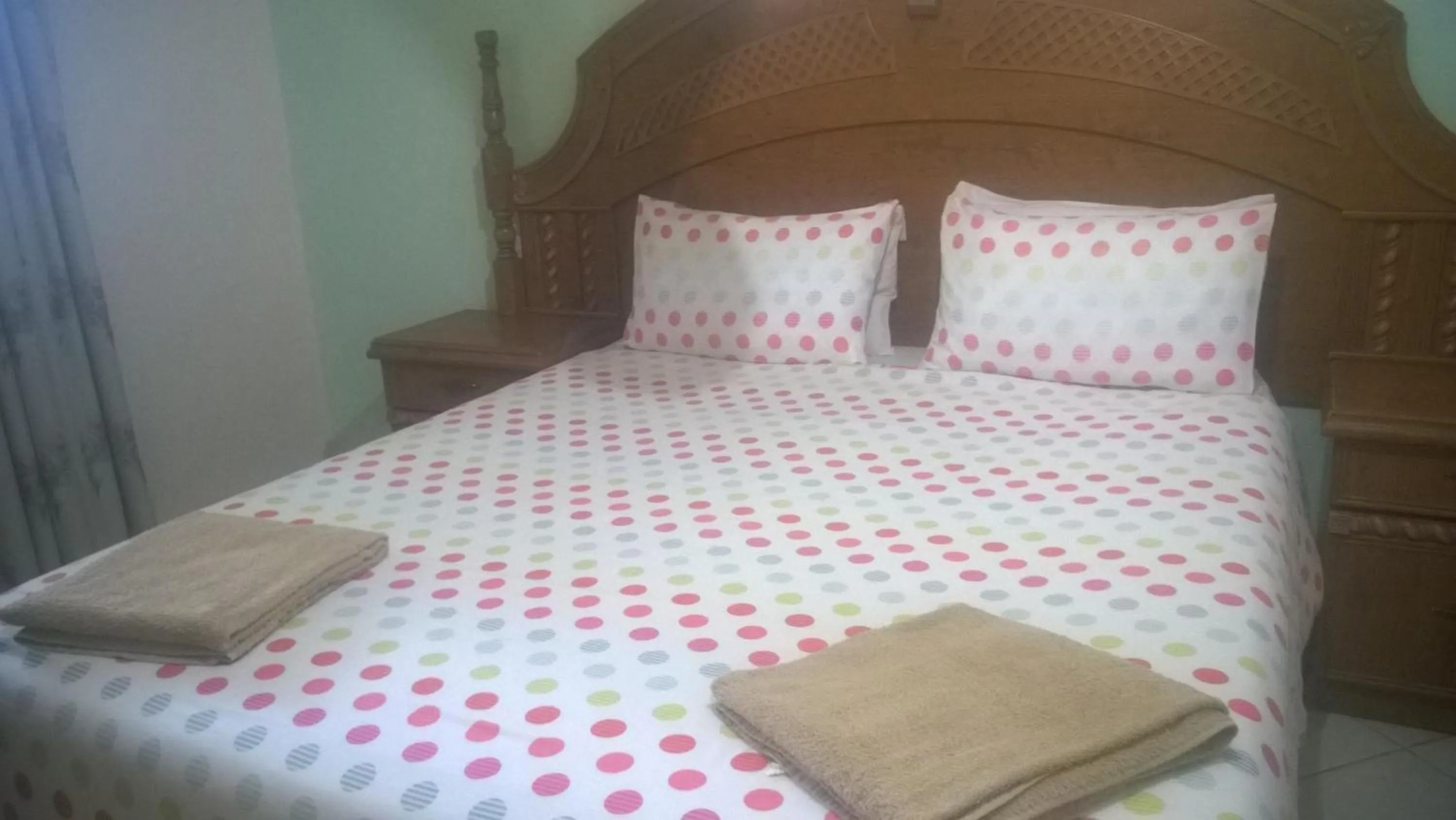 Bed in Gloria's Bed and Breakfast