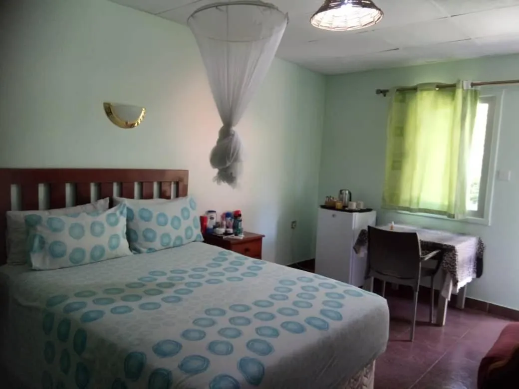 Bed in Gloria's Bed and Breakfast