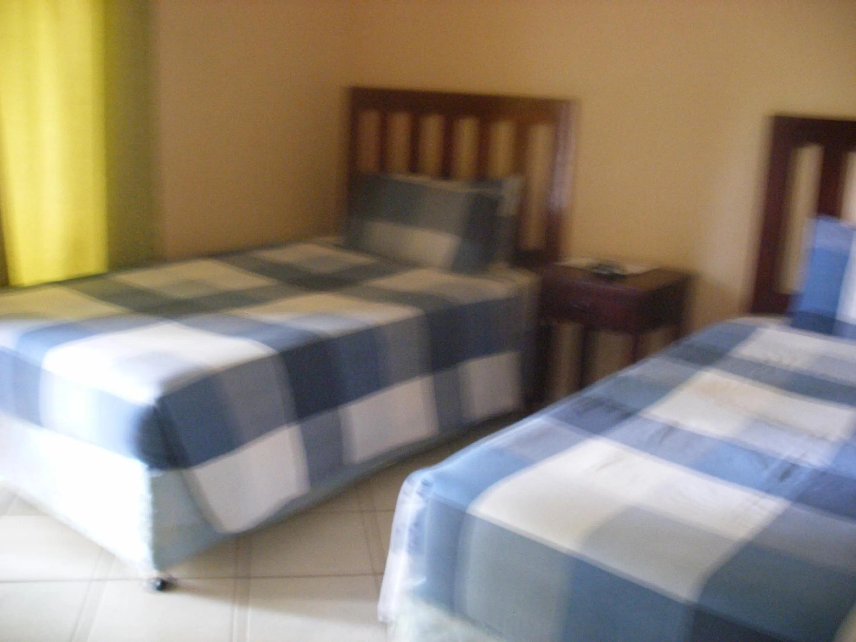 Bed in Gloria's Bed and Breakfast