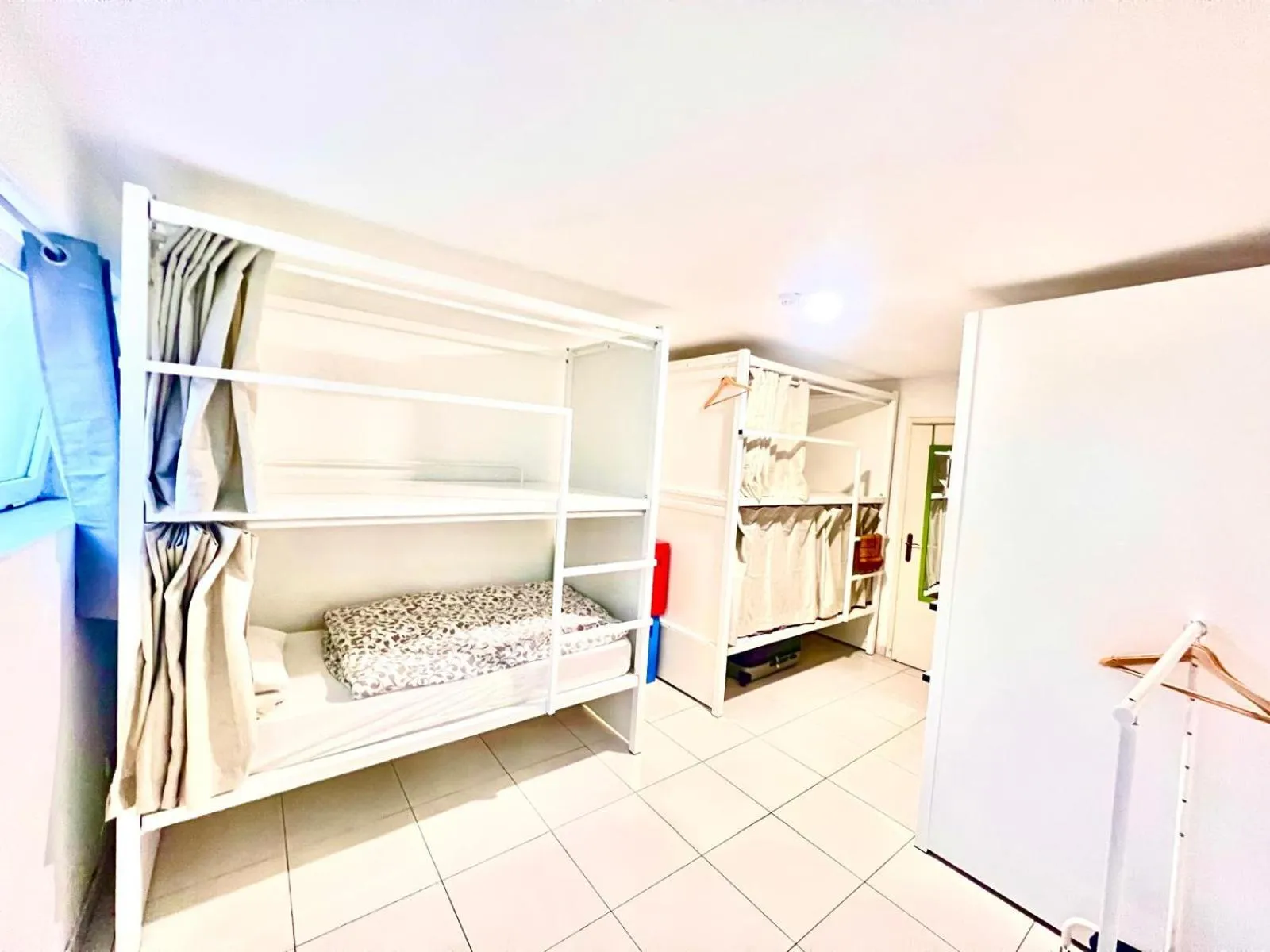 Bed in SwissPorto Guest House