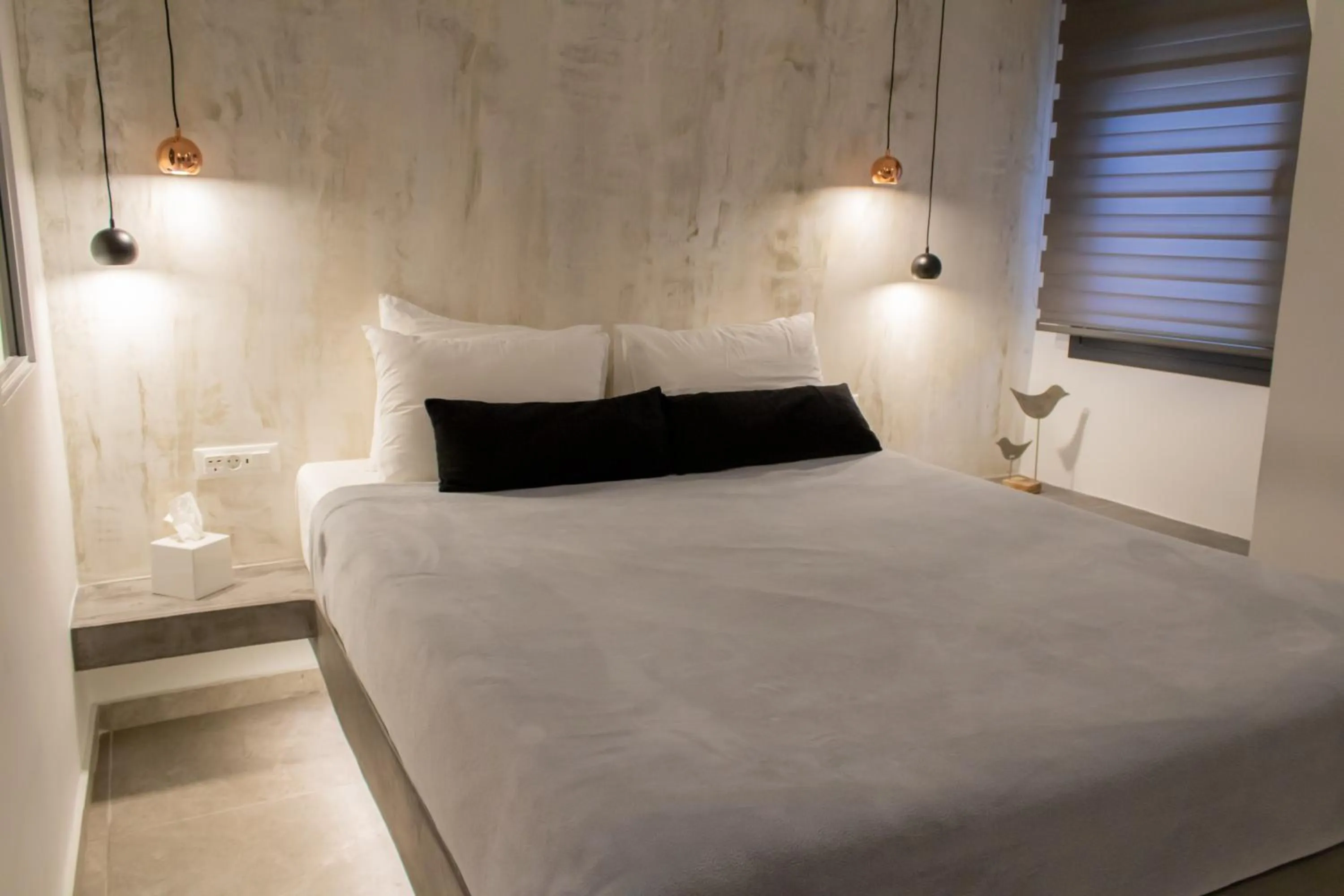 Bed in George & Joanna Suites Santorini