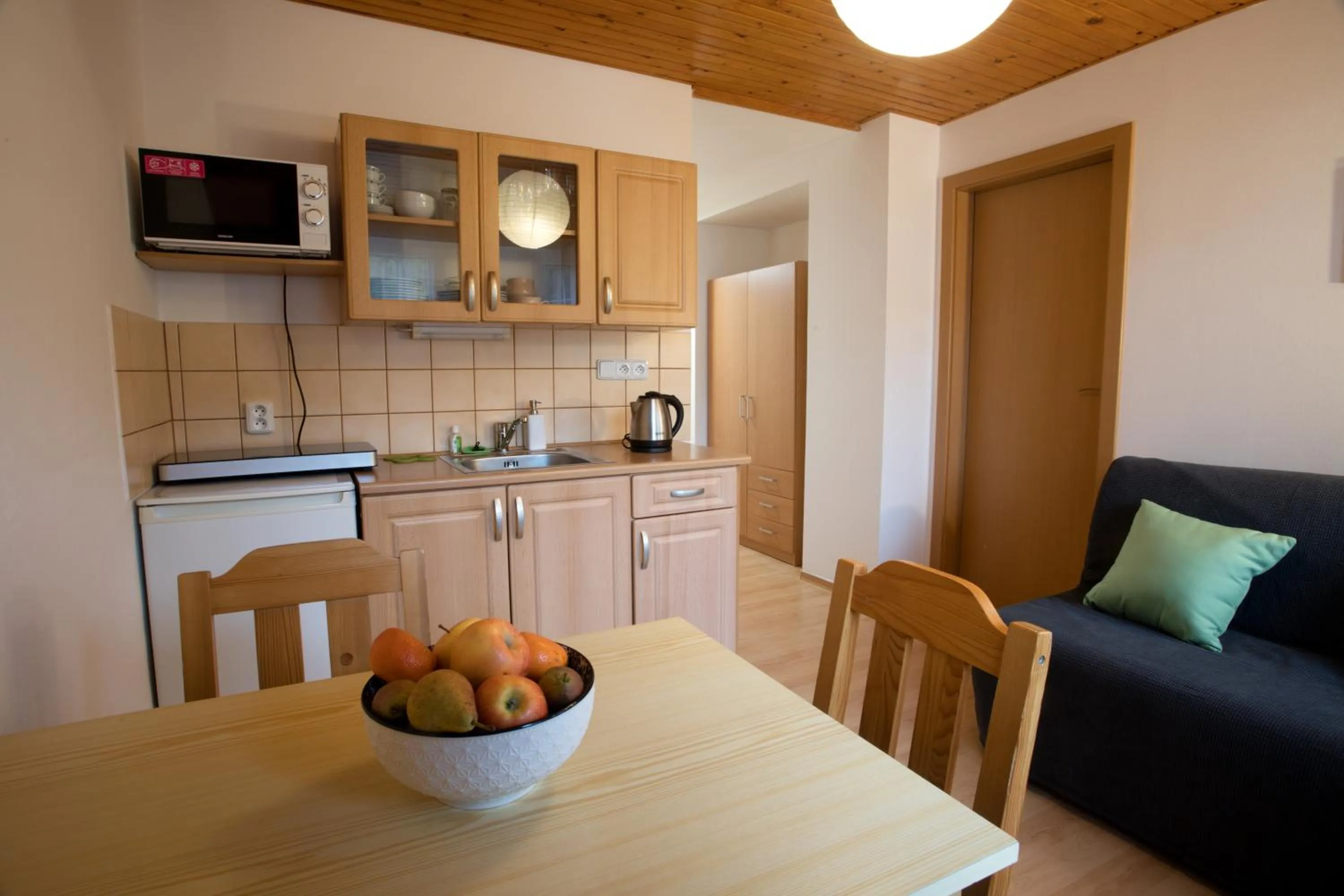 Kitchen or kitchenette in Apartmány Bramborka