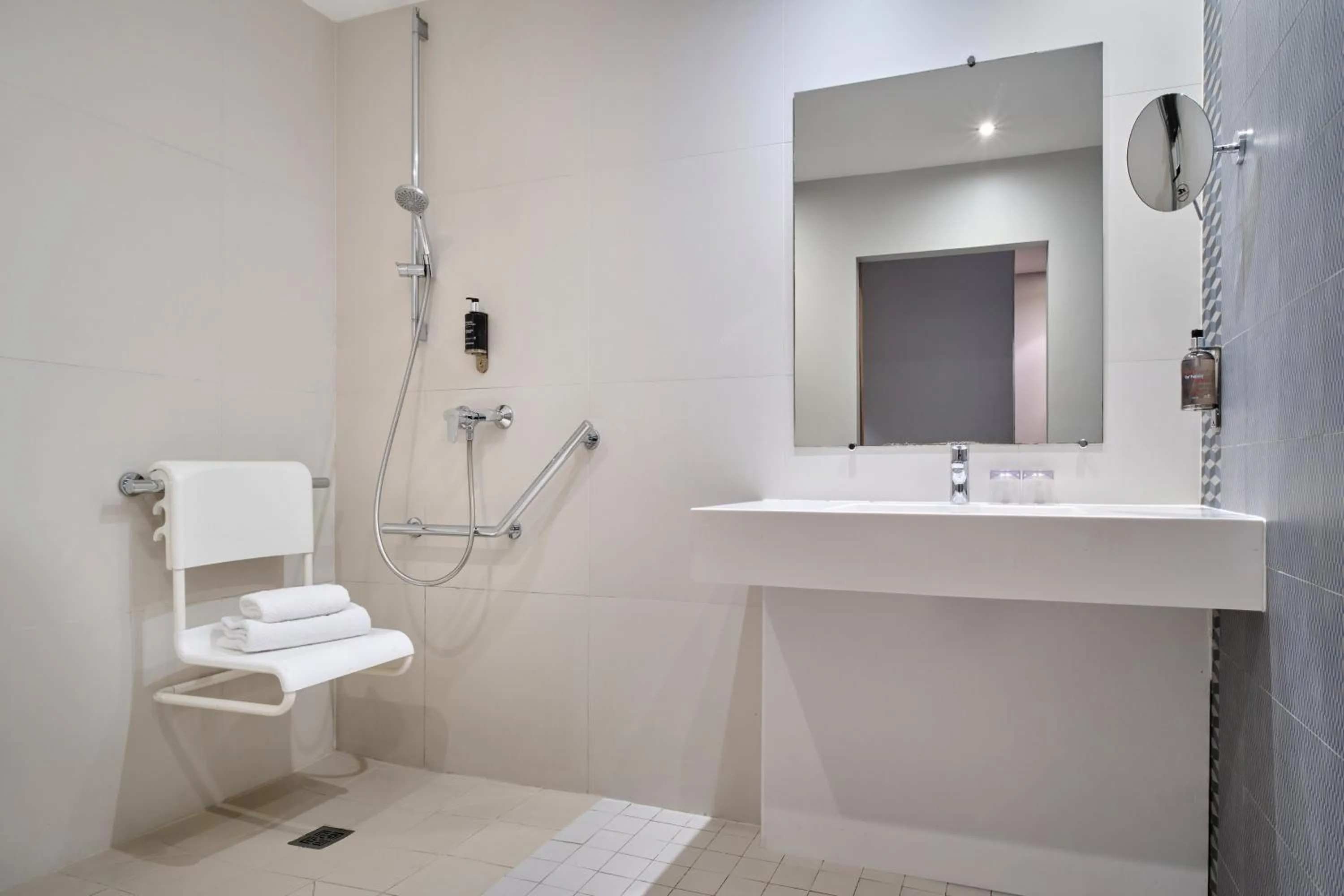 Shower in Hotel Atrium by Happyculture