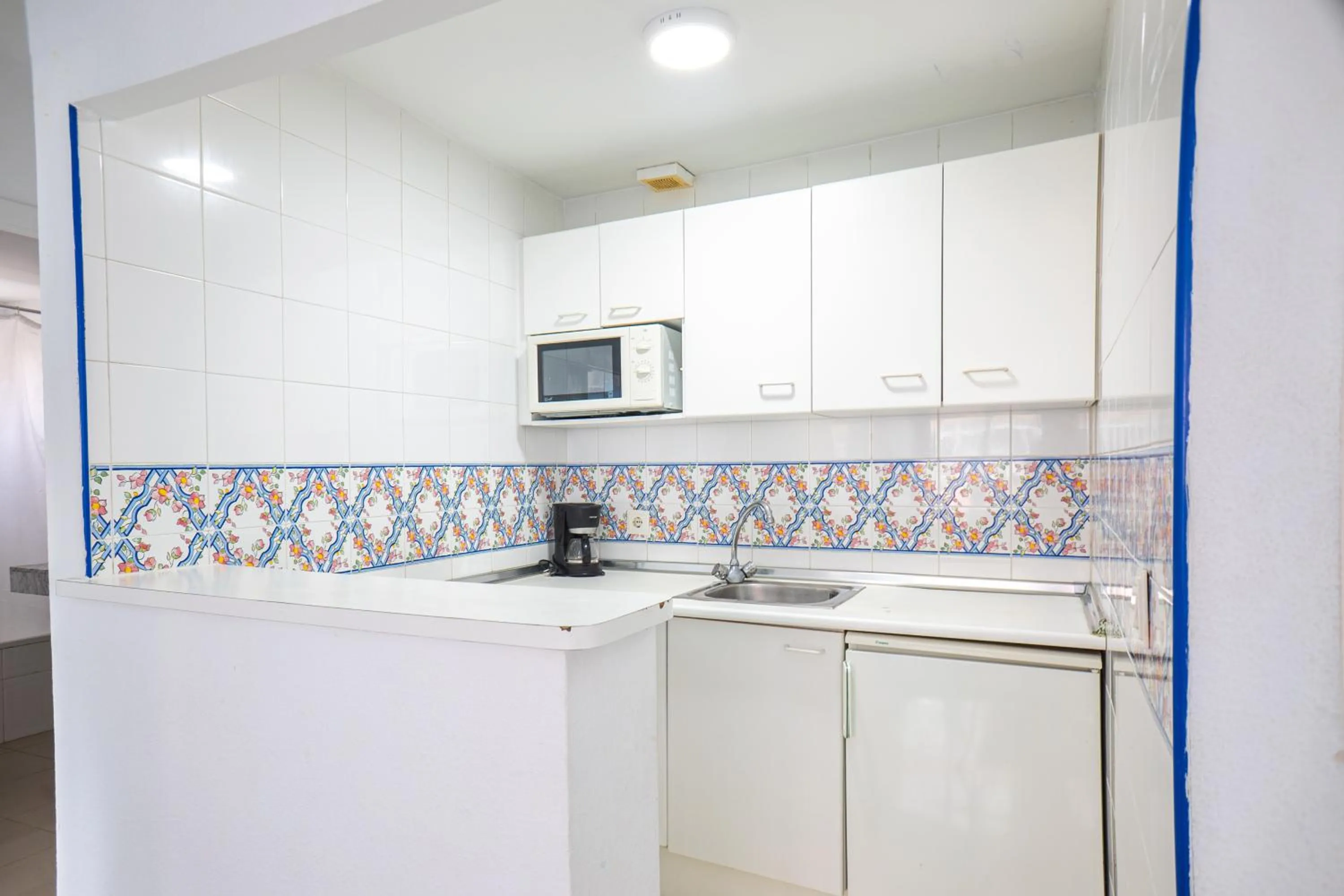 Kitchen or kitchenette in Apartamentos El Velero