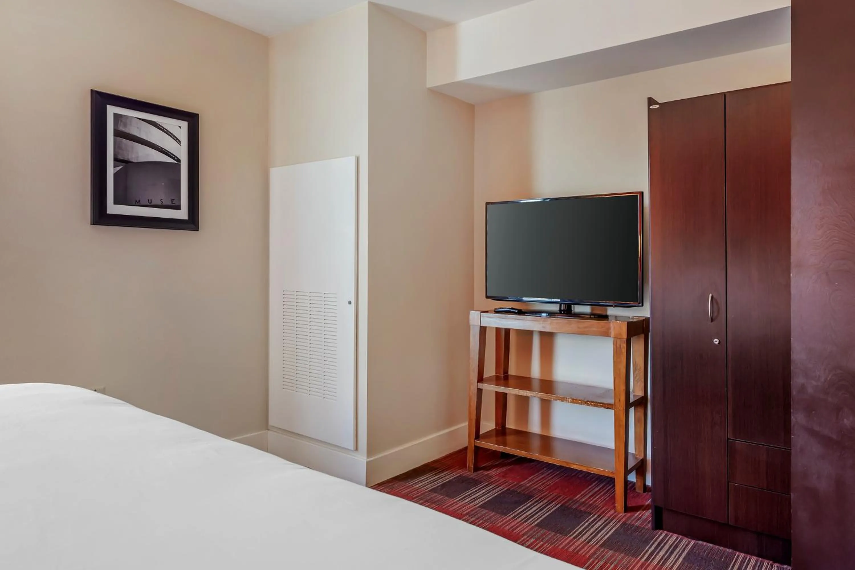 Bedroom in Polynesian Hotel & Suites