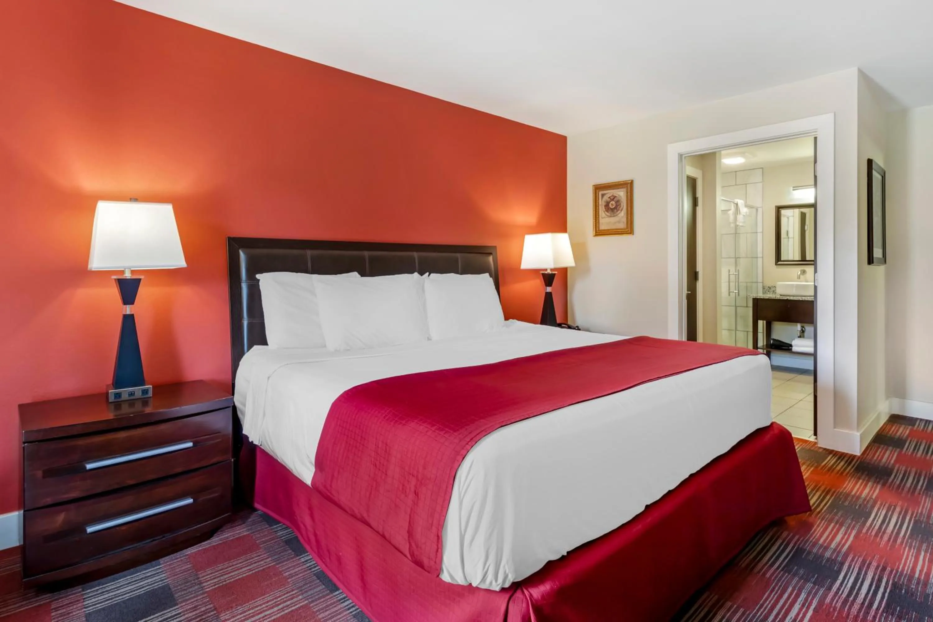 Bed in Polynesian Hotel & Suites