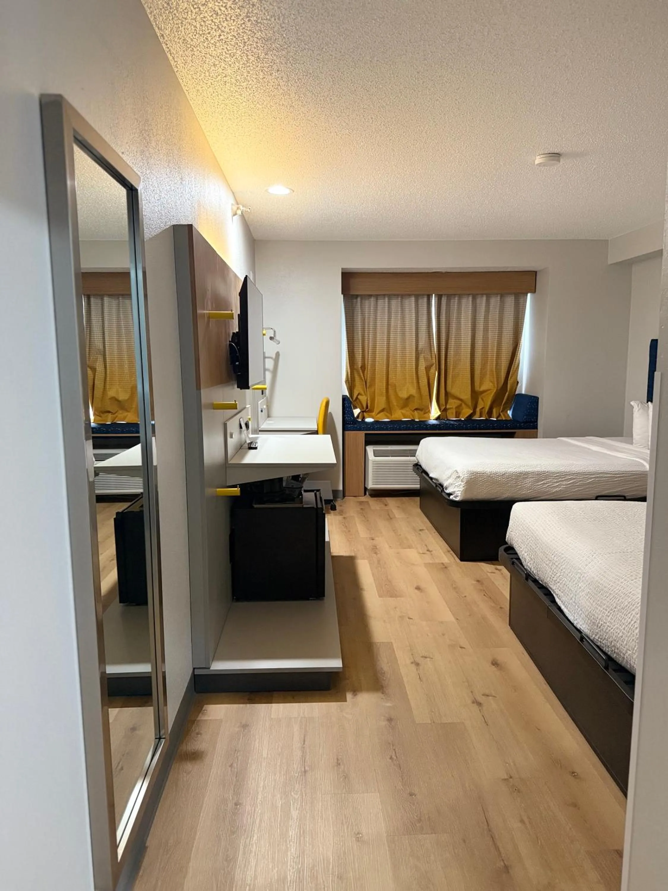 Bed in Microtel Inn & Suites by Wyndham Sioux Falls