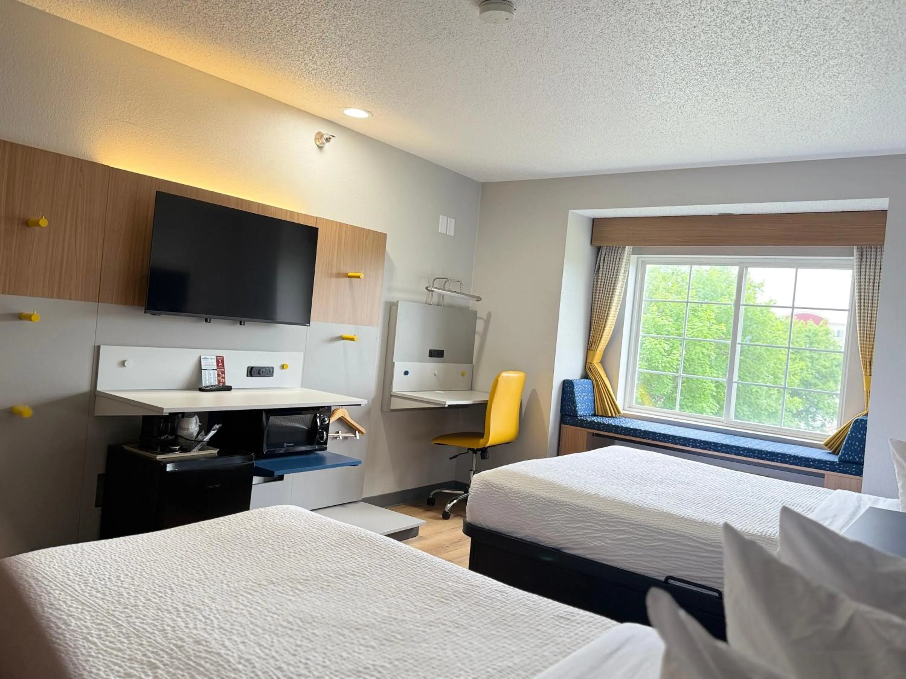 Bed in Microtel Inn & Suites by Wyndham Sioux Falls