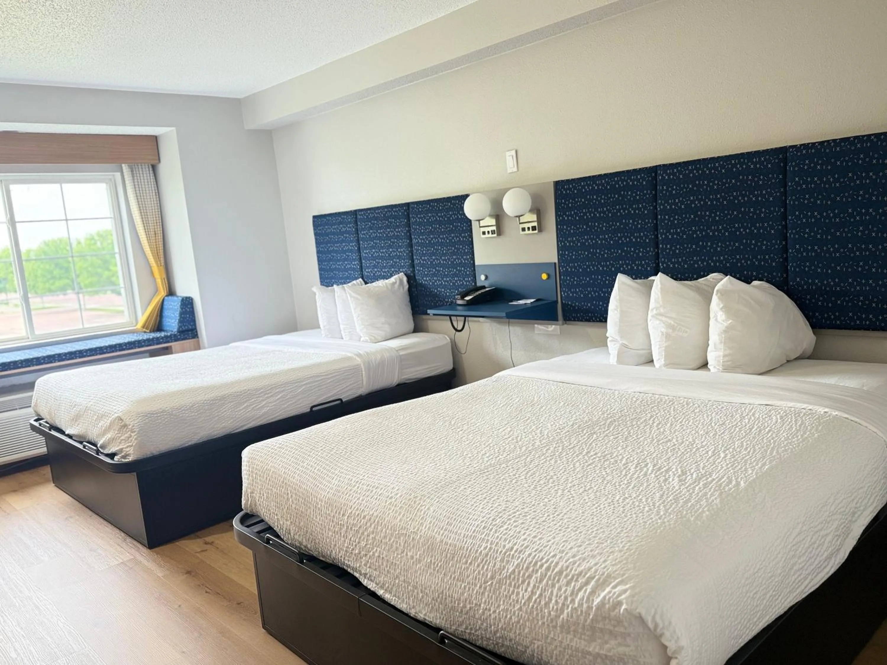 Bed in Microtel Inn & Suites by Wyndham Sioux Falls