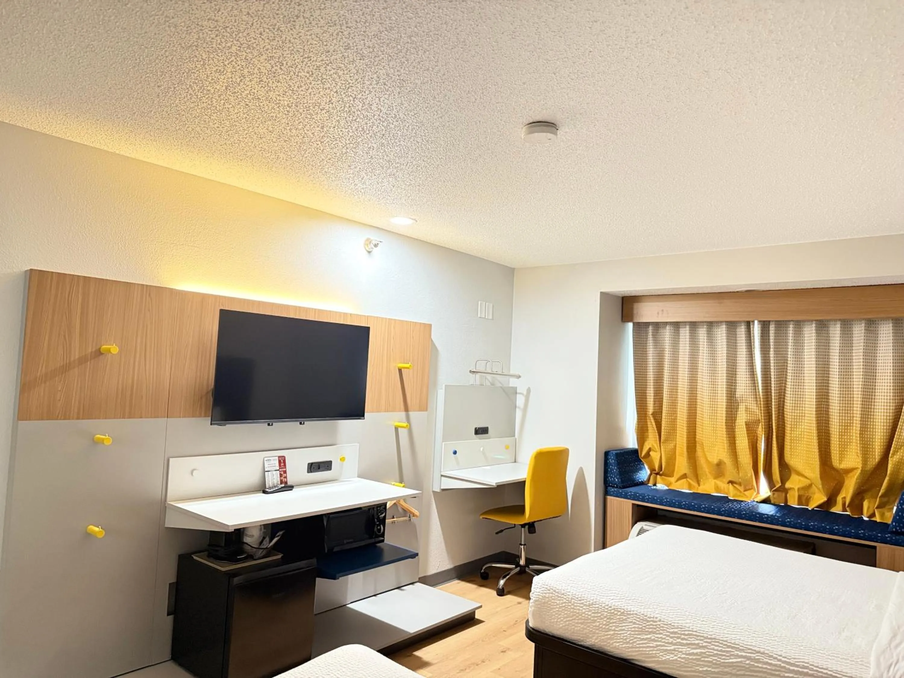 Bed in Microtel Inn & Suites by Wyndham Sioux Falls