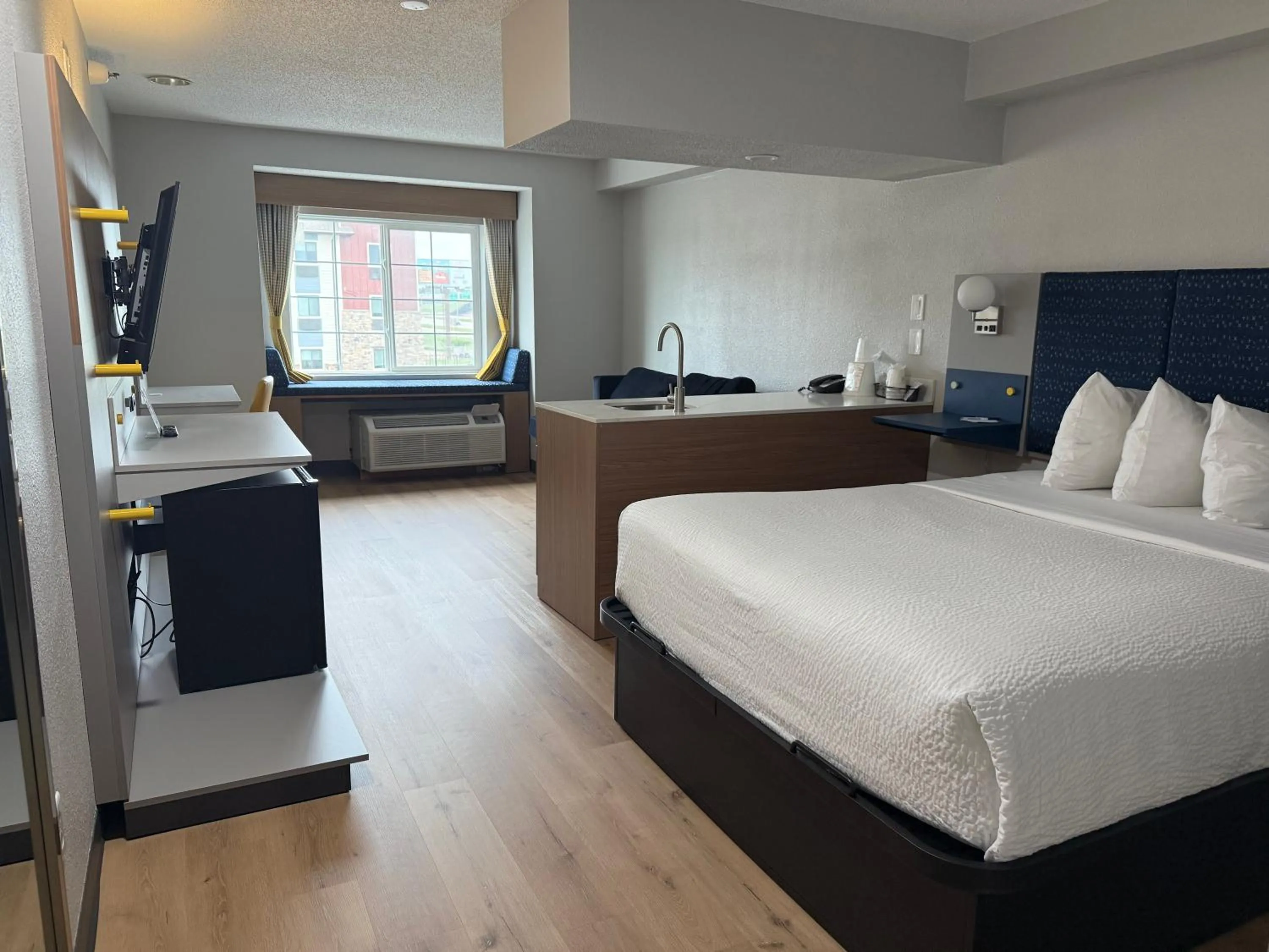 Bed in Microtel Inn & Suites by Wyndham Sioux Falls