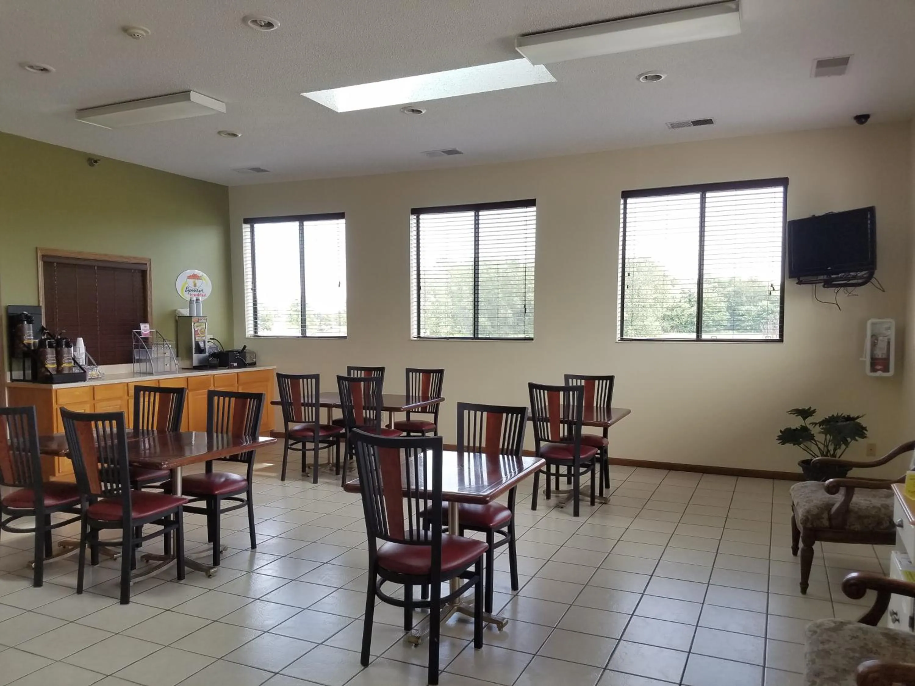 Communal lounge/ TV room in Super 8 by Wyndham DeKalb IL