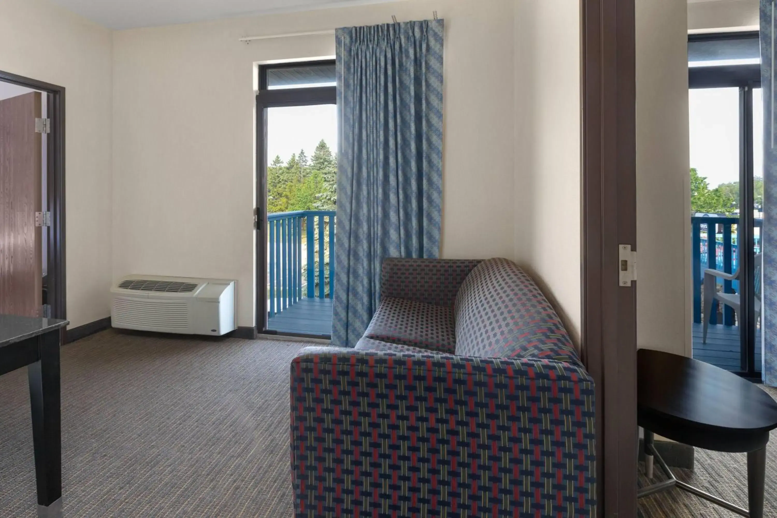 Two-Bedroom Suite with Four Queen Beds and Balcony - Non-Smoking in Days Inn by Wyndham Mackinaw City - Bridgeview Area Two-Bedroom Suite with Four Queen Beds and Balcony - Non-Smoking in Days Inn by Wyndham Mackinaw City - Bridgeview Area