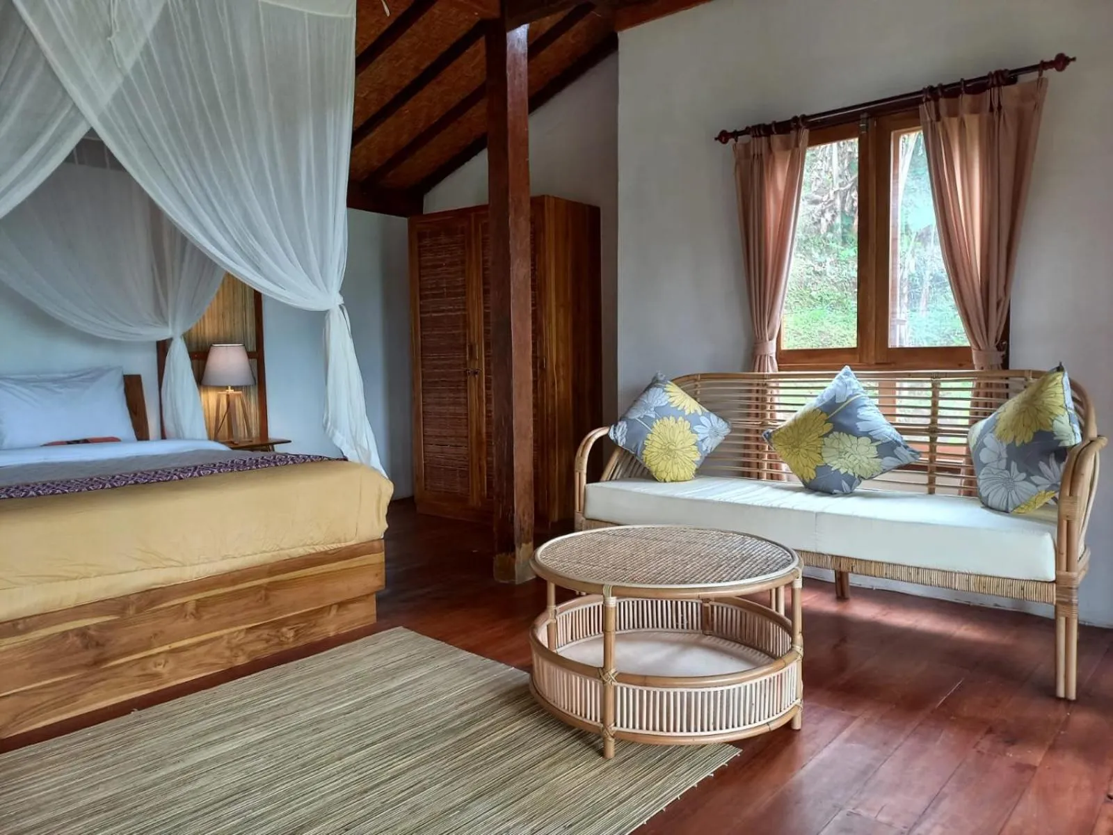 Seating area, Bed in Sang Tirta Resort