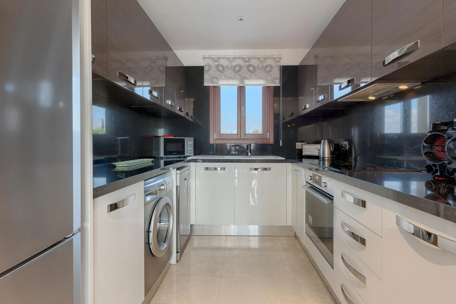 Kitchen or kitchenette in Aphrodite Hills Rentals - Premium Serviced Apartments