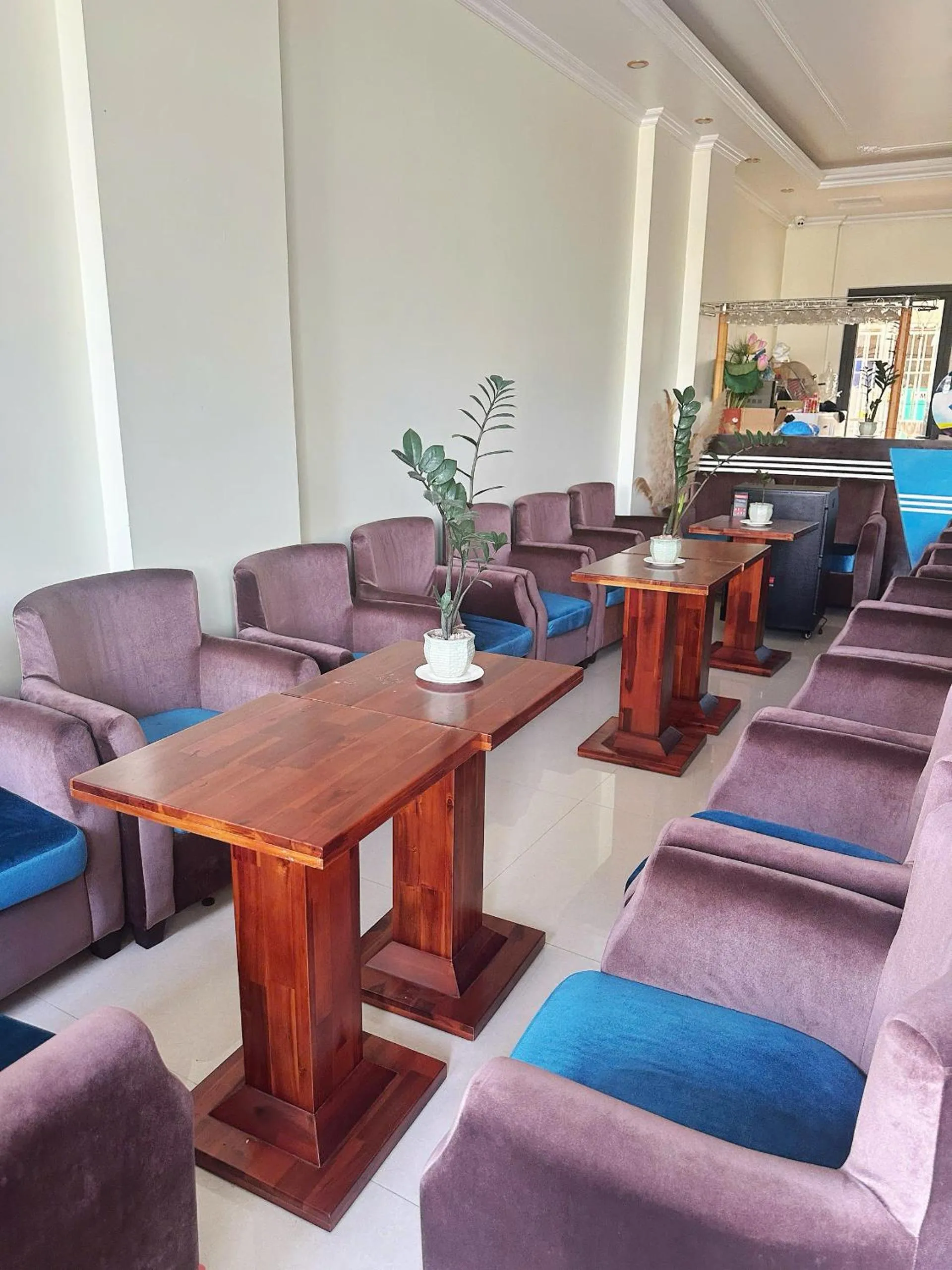 Communal lounge/ TV room in May House Hotel