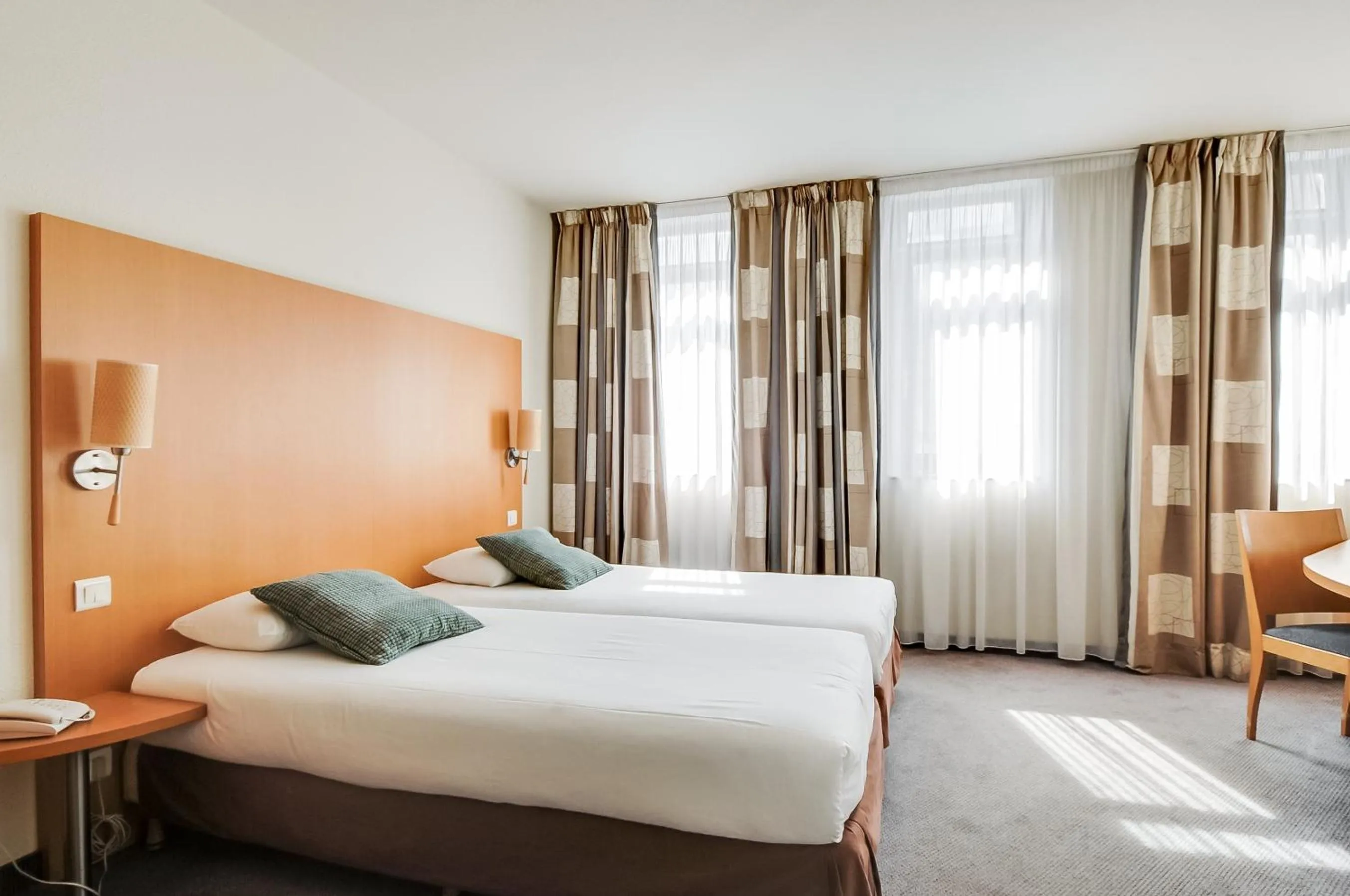 Bed in La Maison Hôtel Mulhouse Centre