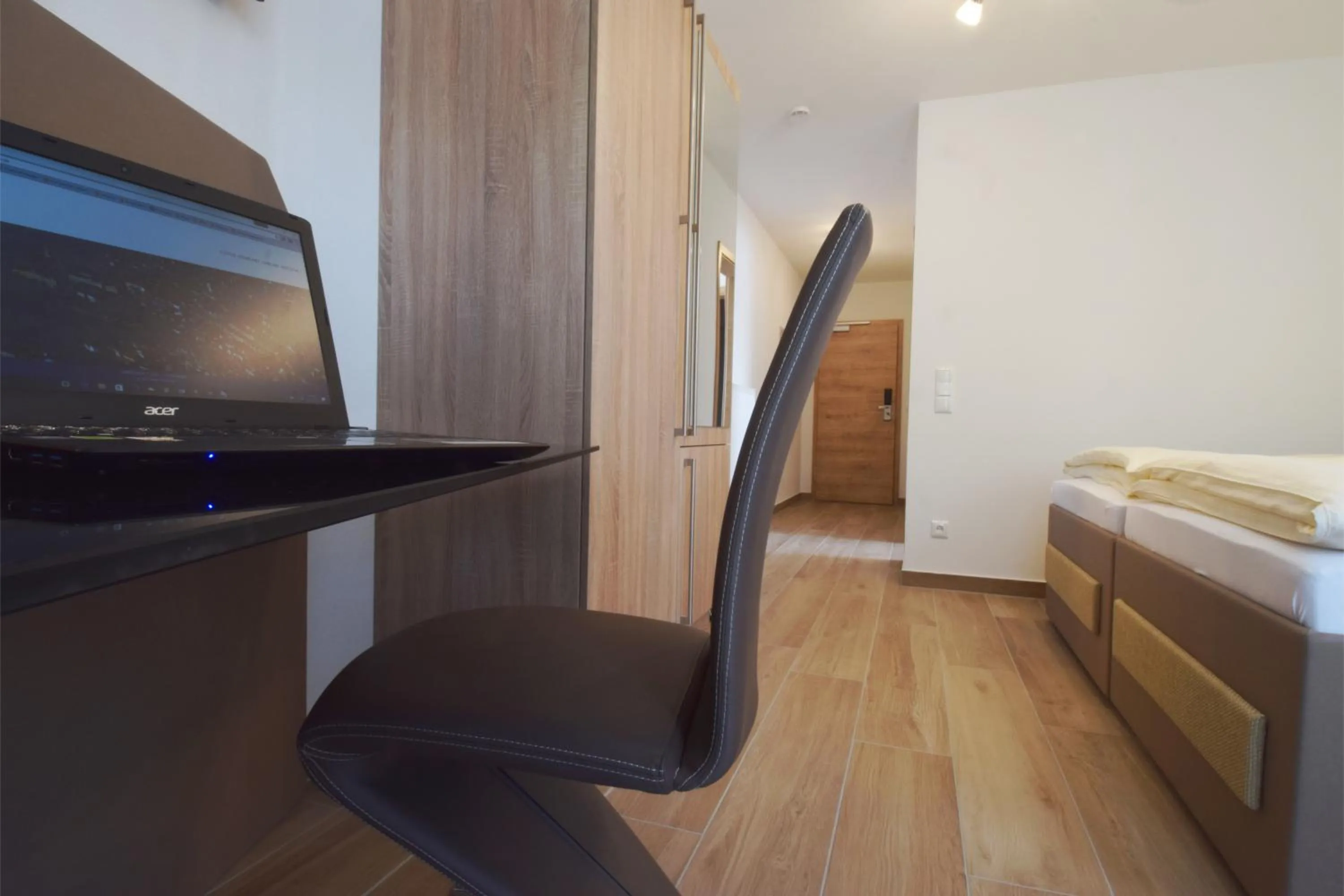 Seating area, Bed in Aparthotel Donaustern