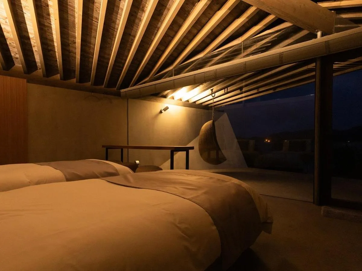 Bed in Denpaku The Beachfront MIJORA