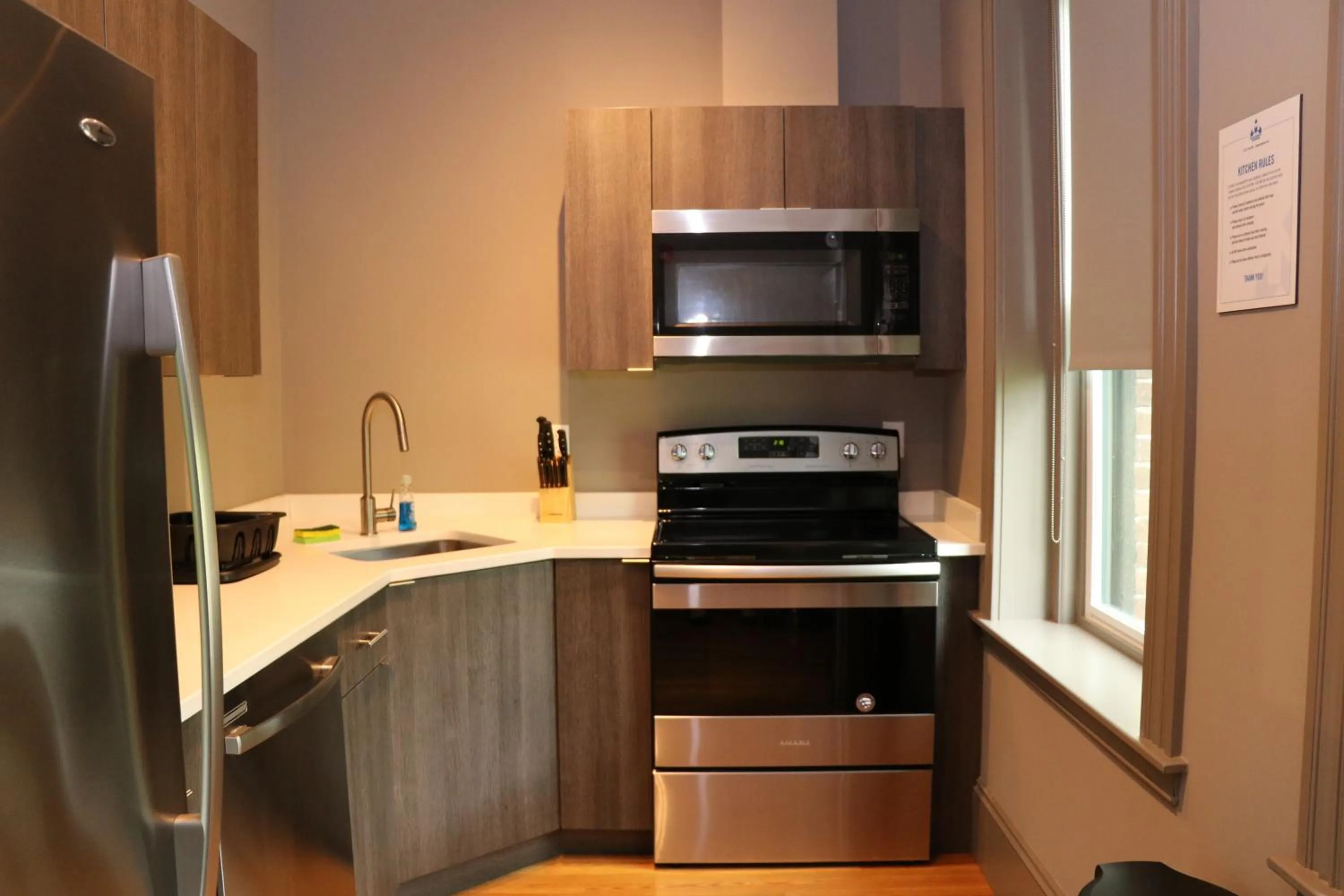 Communal kitchen in A Stylish Stay w/ a Queen Bed, Heated Floors.. #23