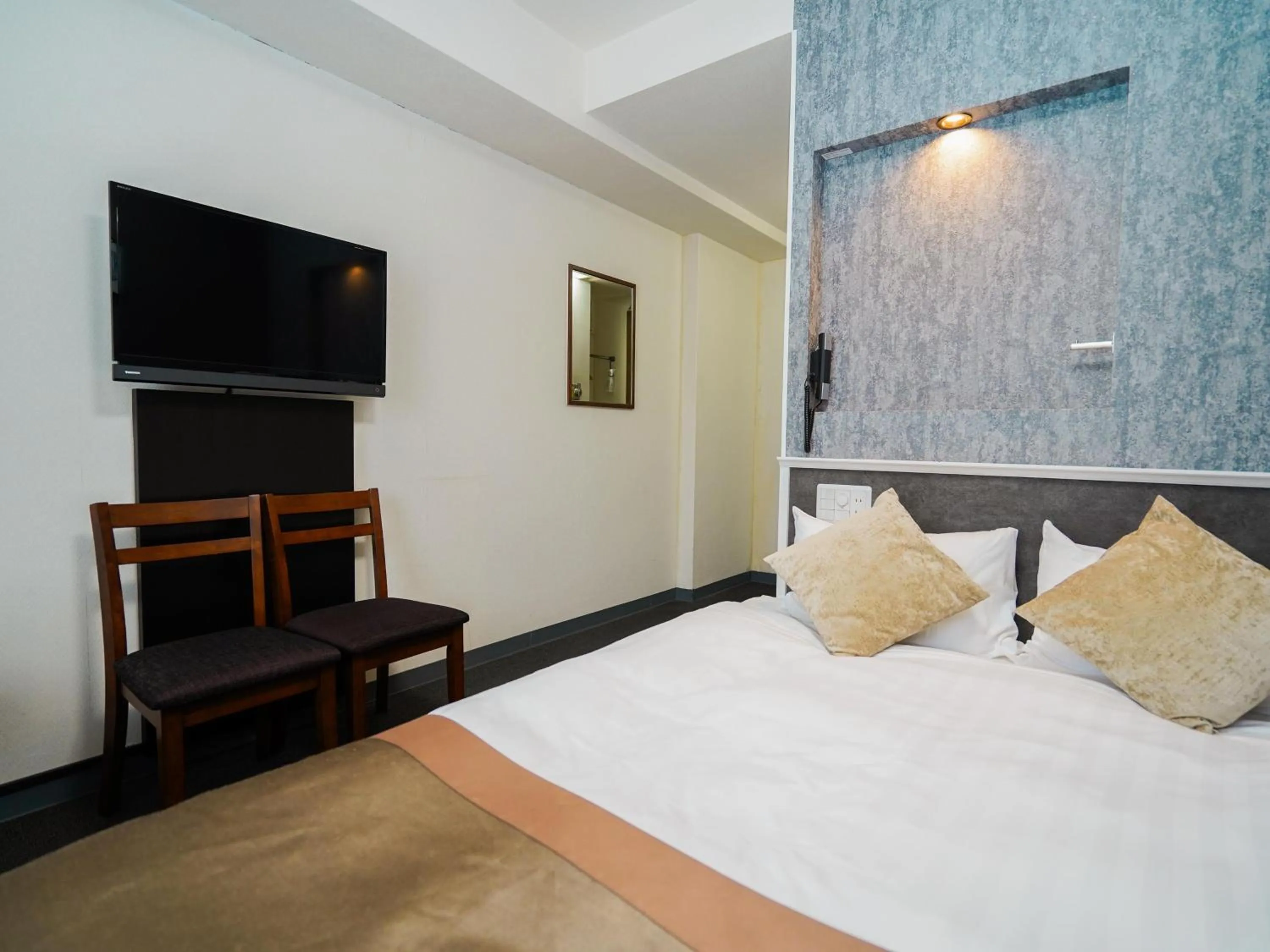 Photo of the whole room, Bed in Hotel AreaOne Okayama