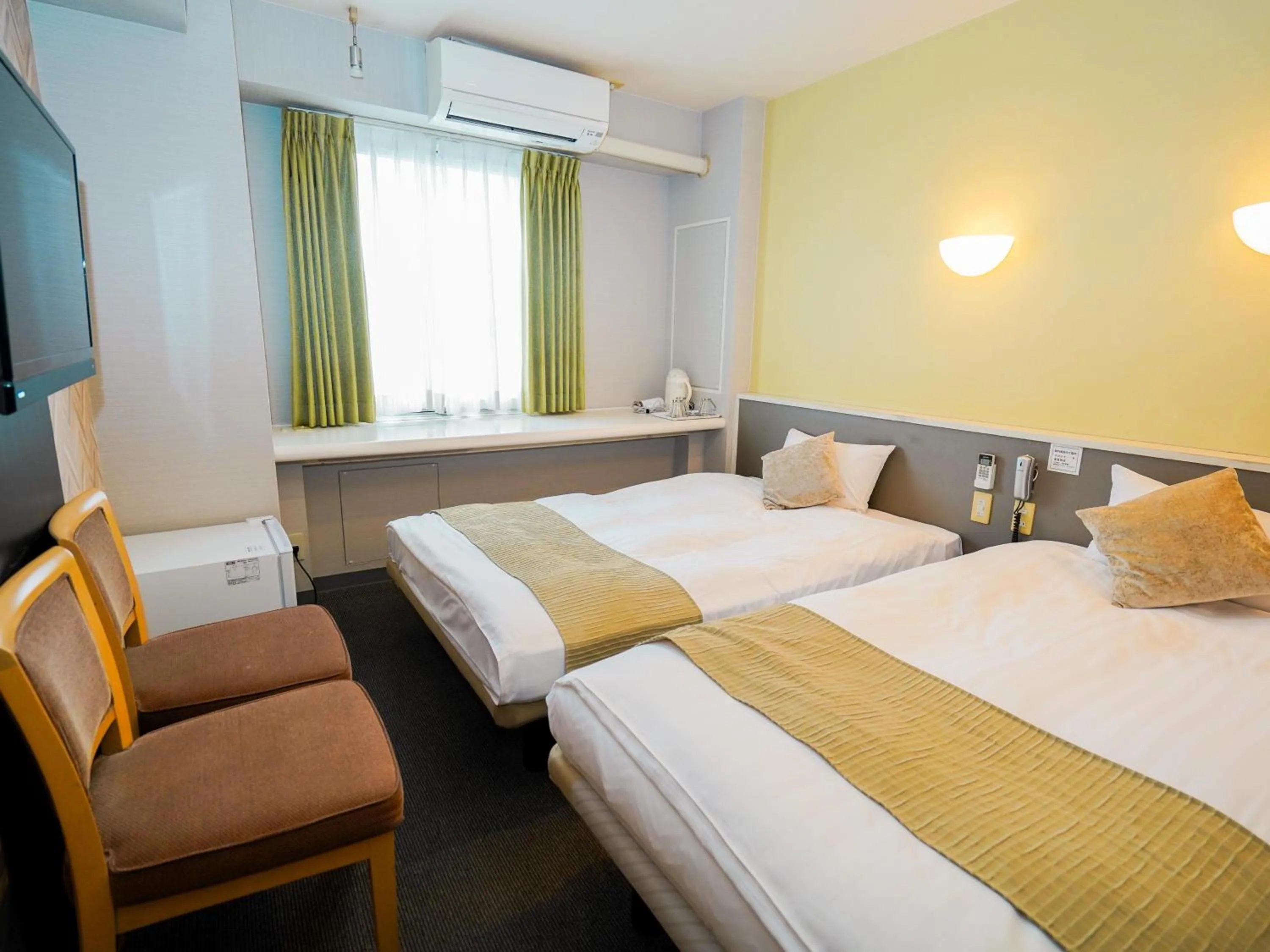 Photo of the whole room, Bed in Hotel AreaOne Okayama