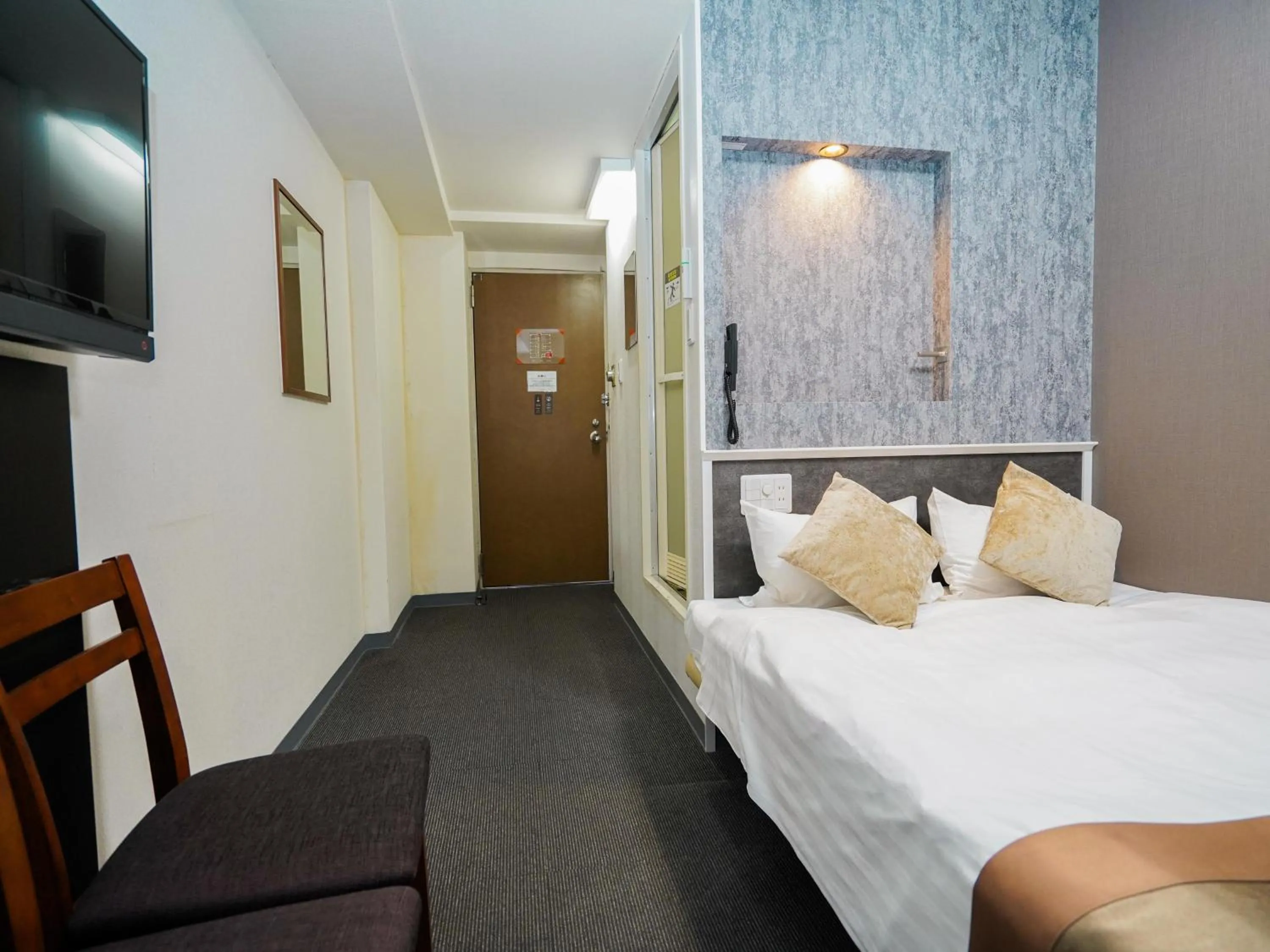 Photo of the whole room, Bed in Hotel AreaOne Okayama