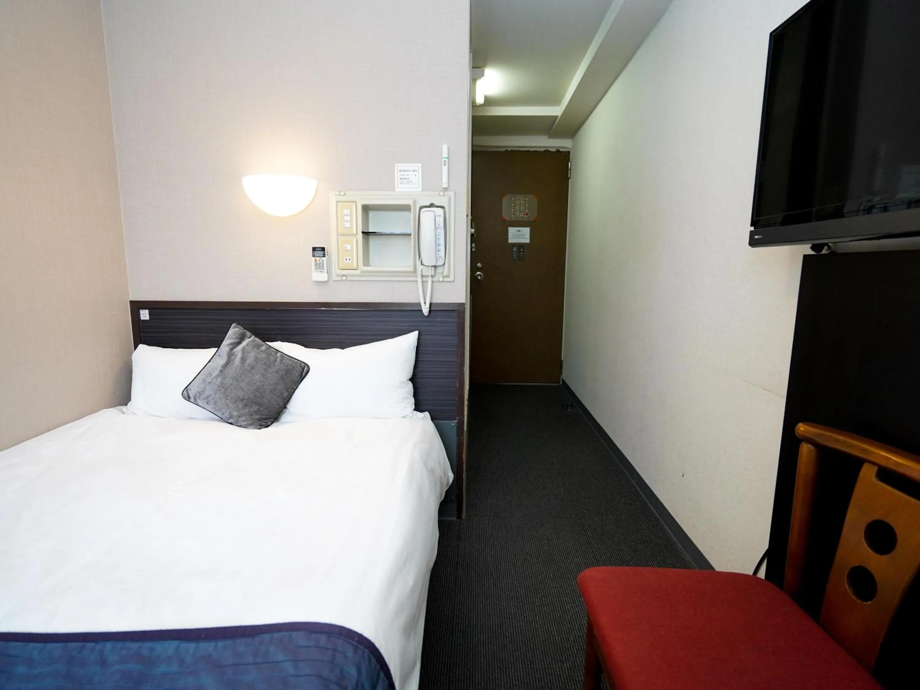 Photo of the whole room, Bed in Hotel AreaOne Okayama