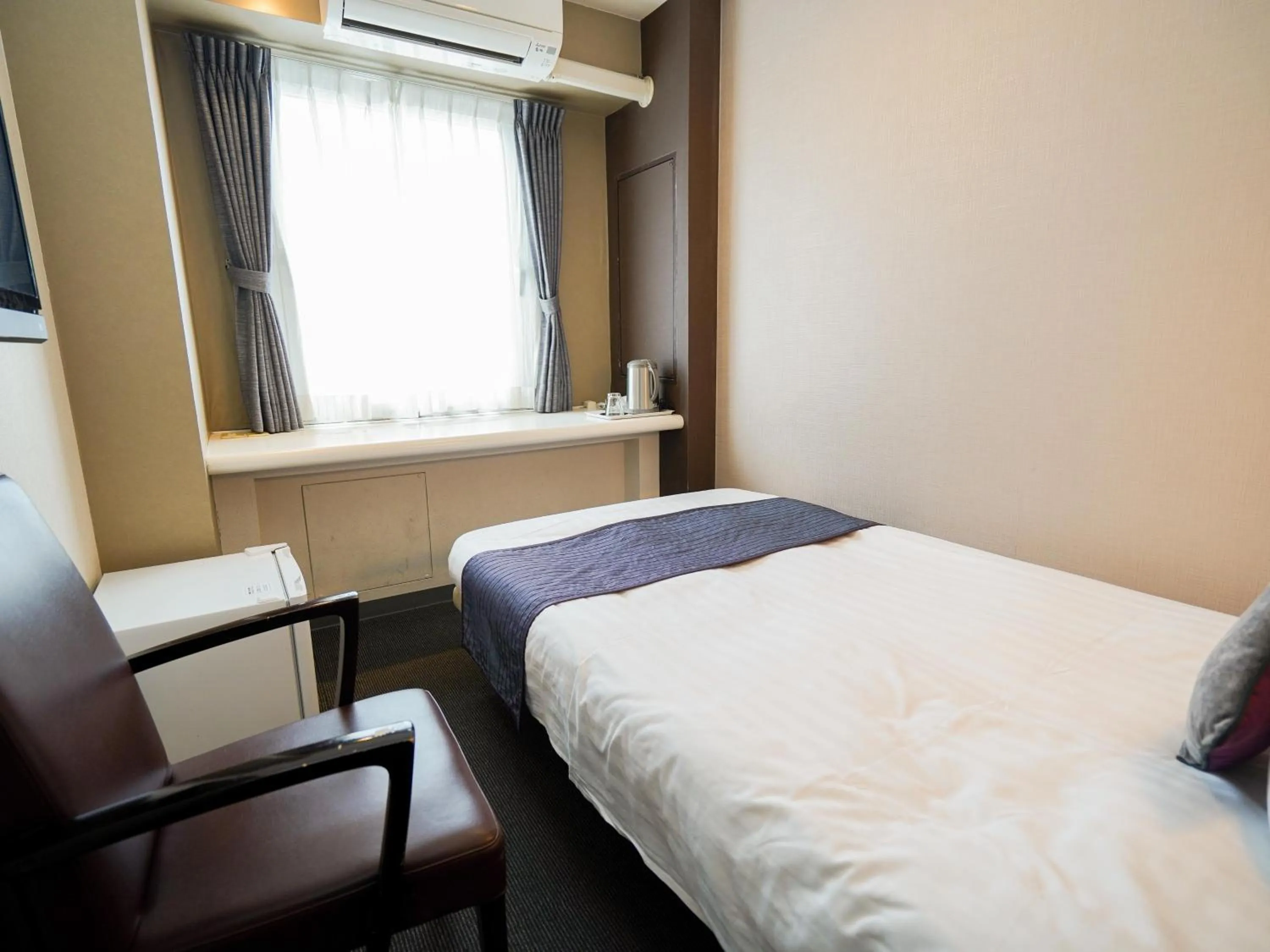 Photo of the whole room, Bed in Hotel AreaOne Okayama