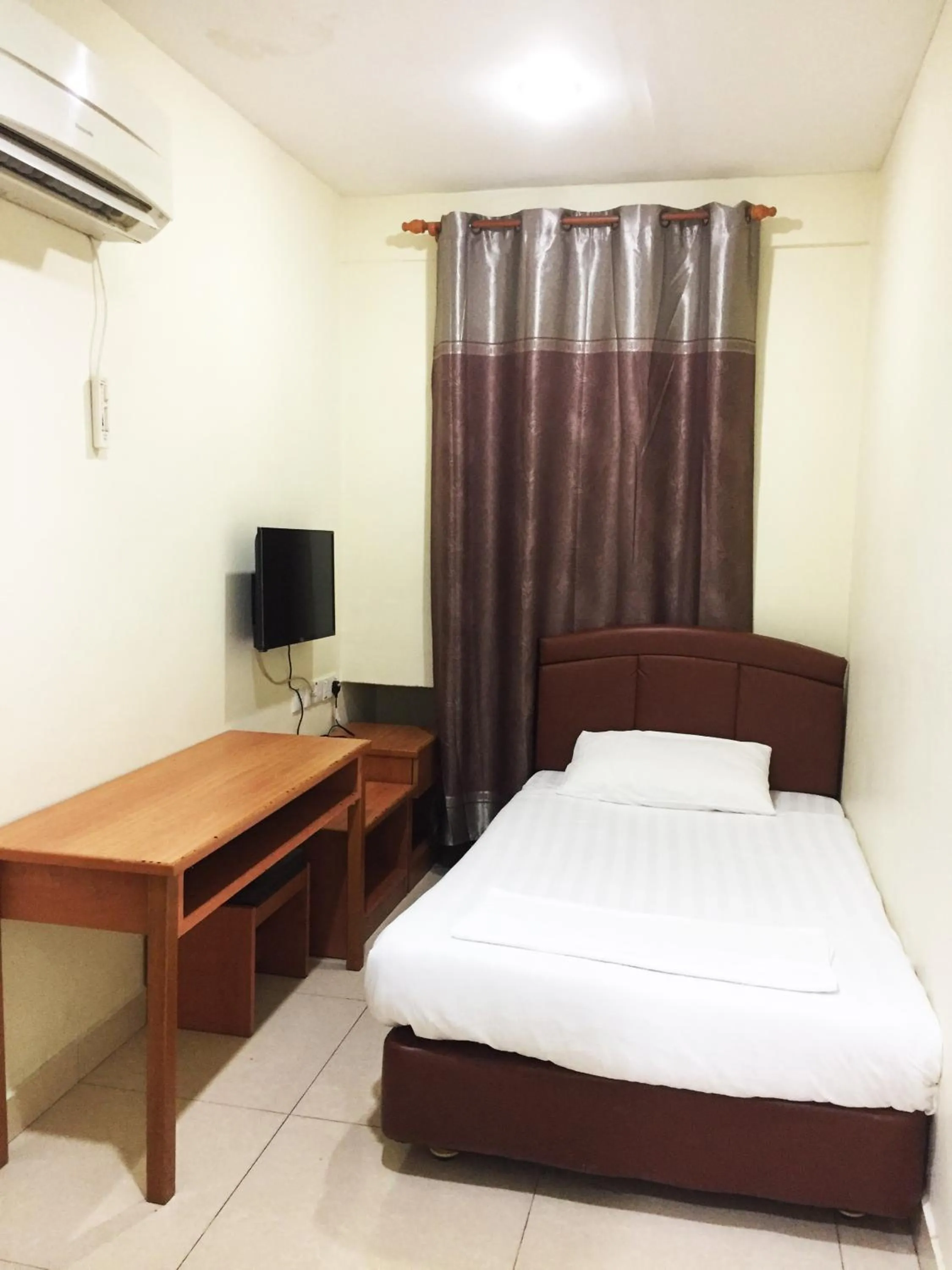 Bed in HK Inn Hua Kiew Inn