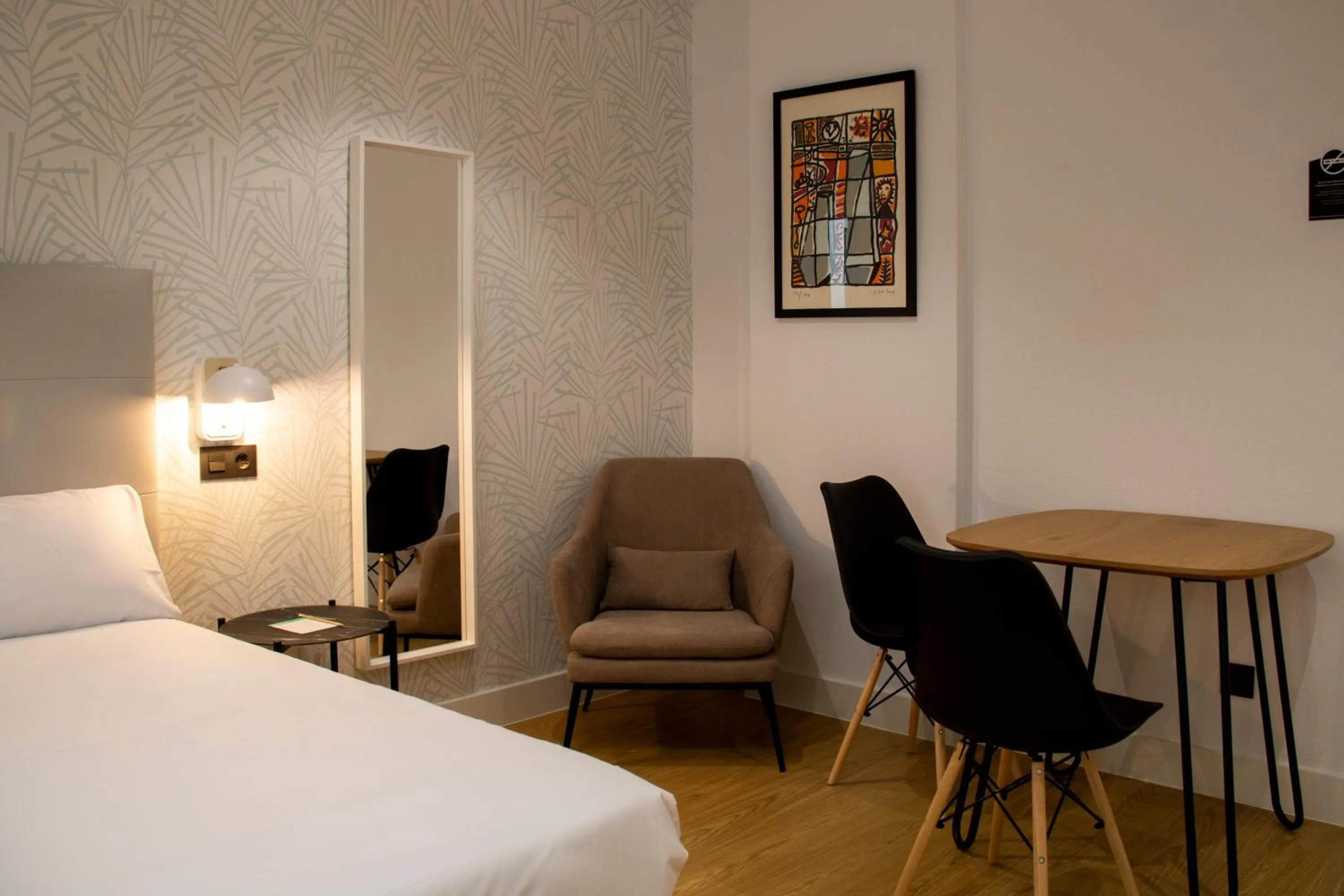 Seating area, Bed in Hotel Alda Orzán