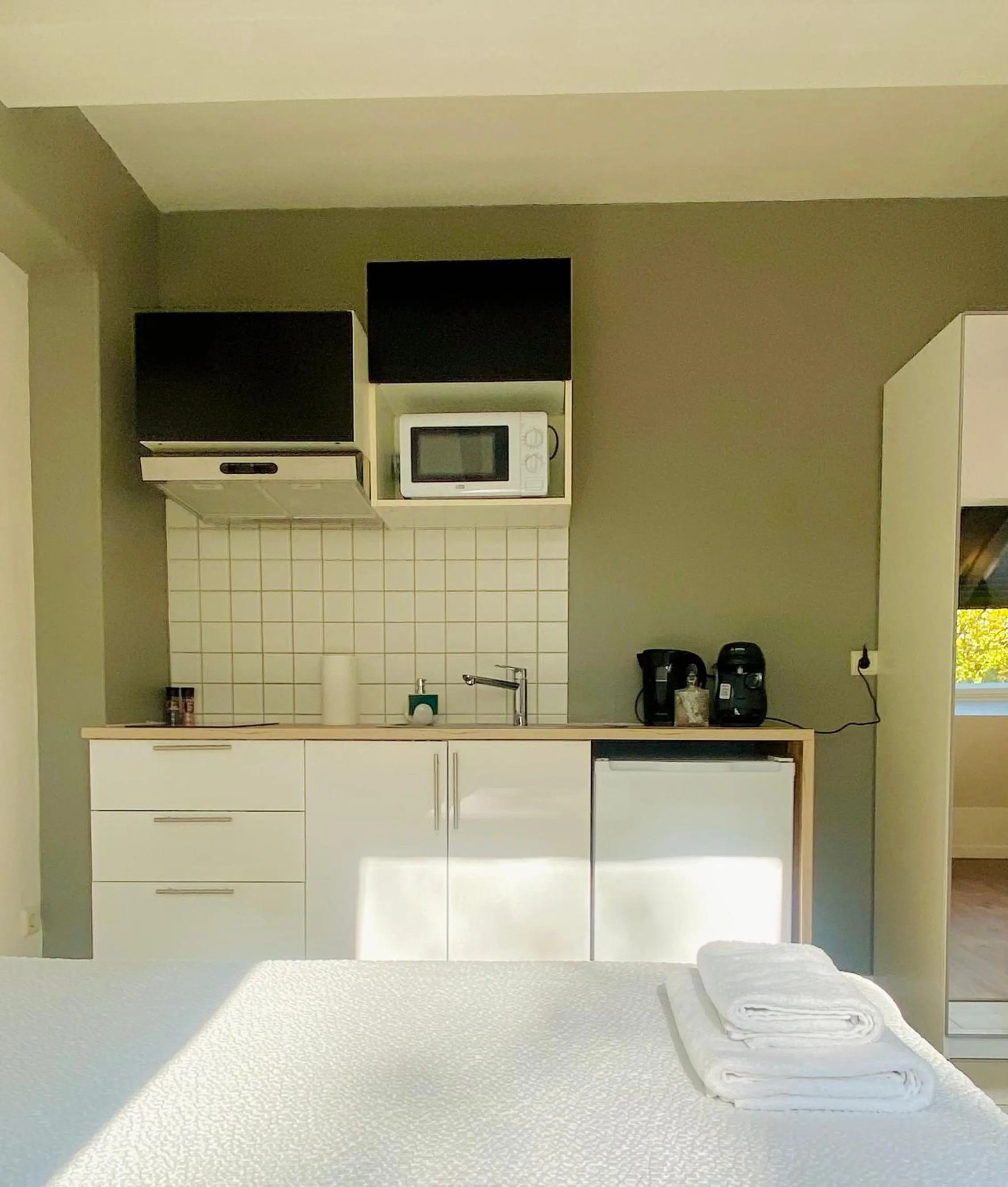 Bed in Aramis Studio Hotel