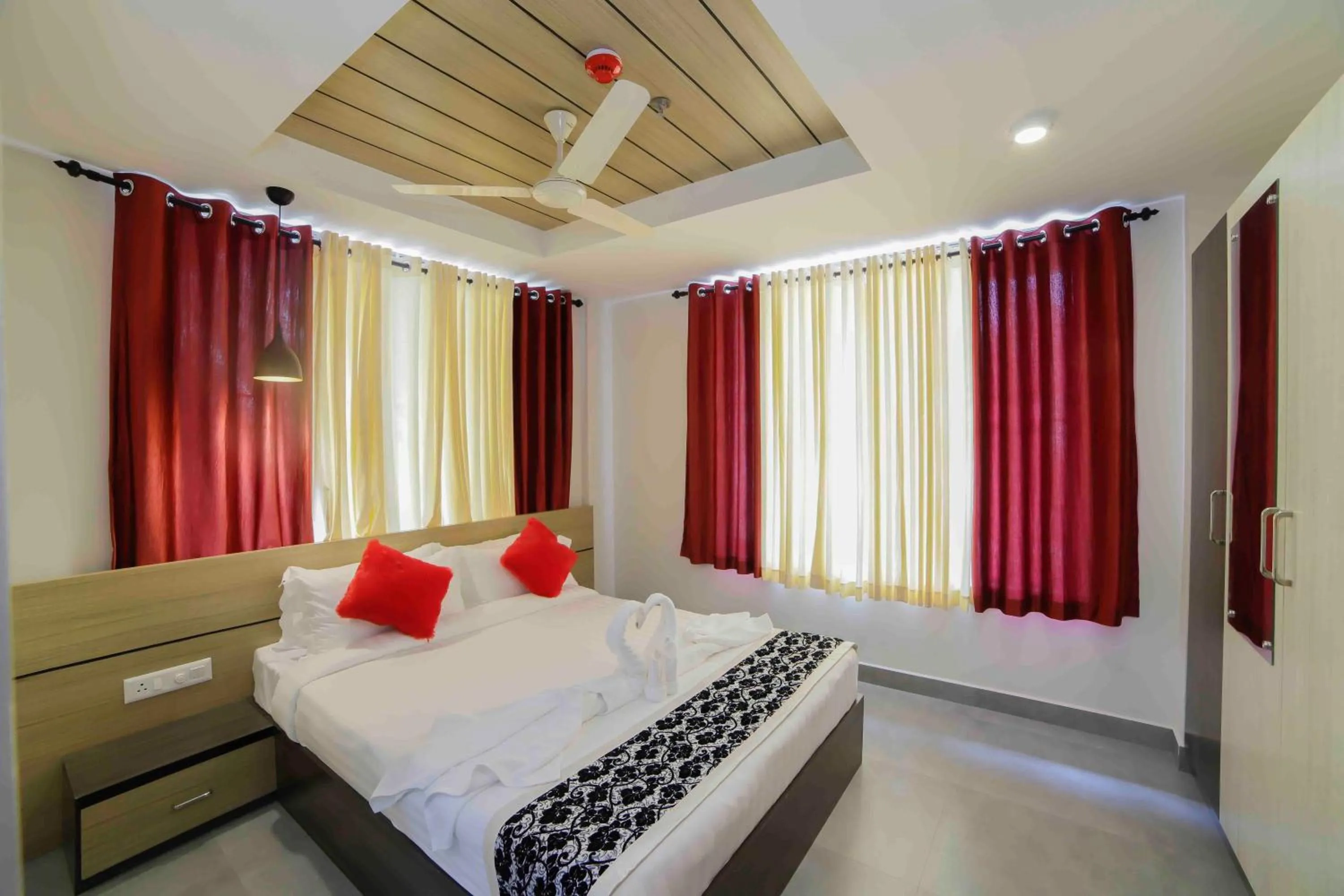 Photo of the whole room, Bed in Bhavanam Regency Guruvayoor
