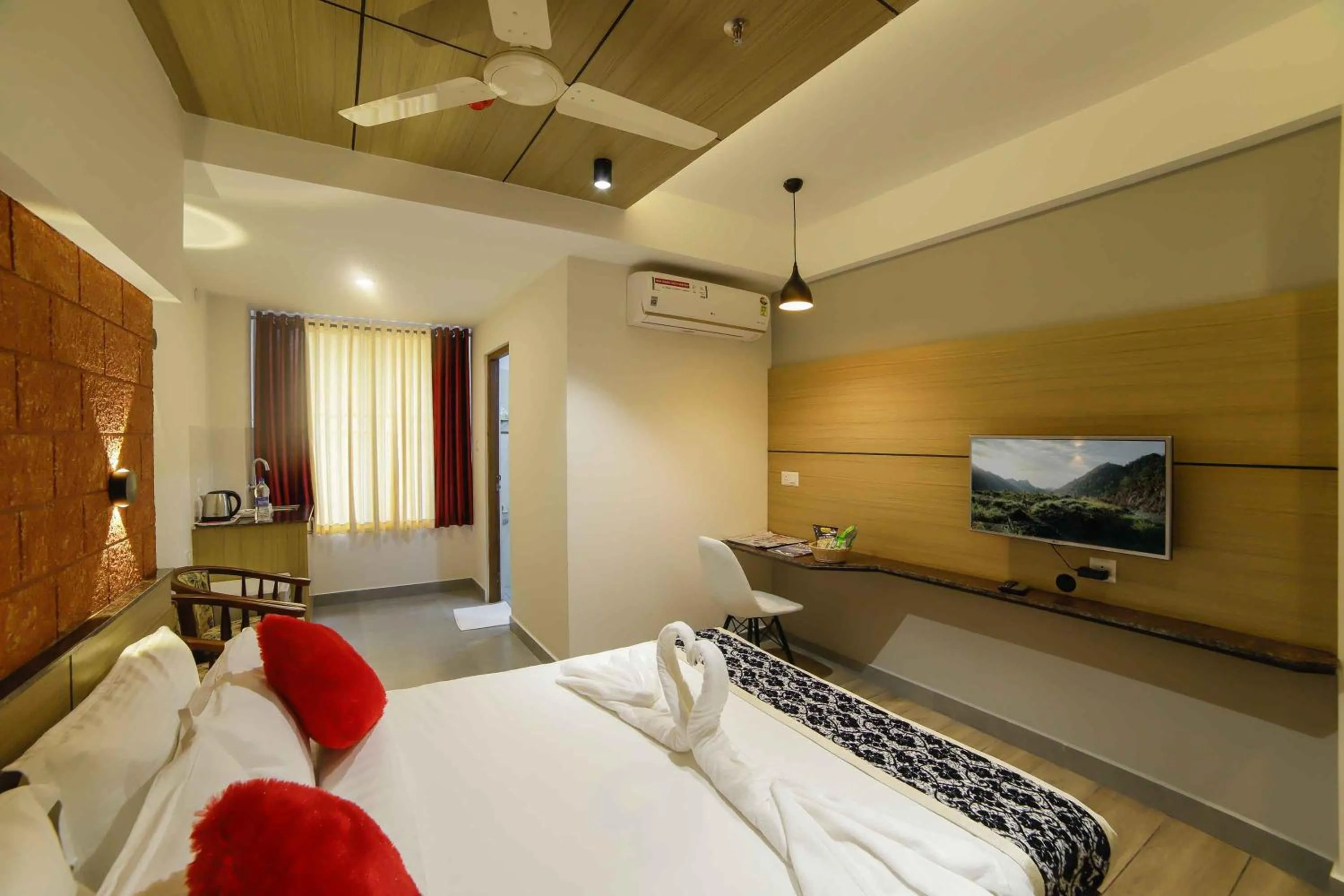 Photo of the whole room, Bed in Bhavanam Regency Guruvayoor